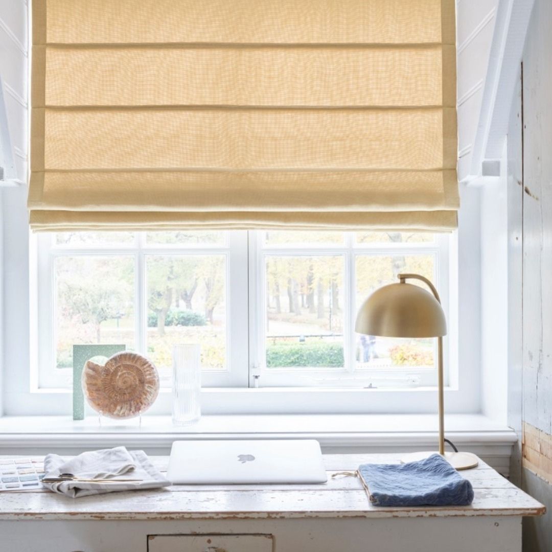 Woven wood shades with natural fibers add style to this office