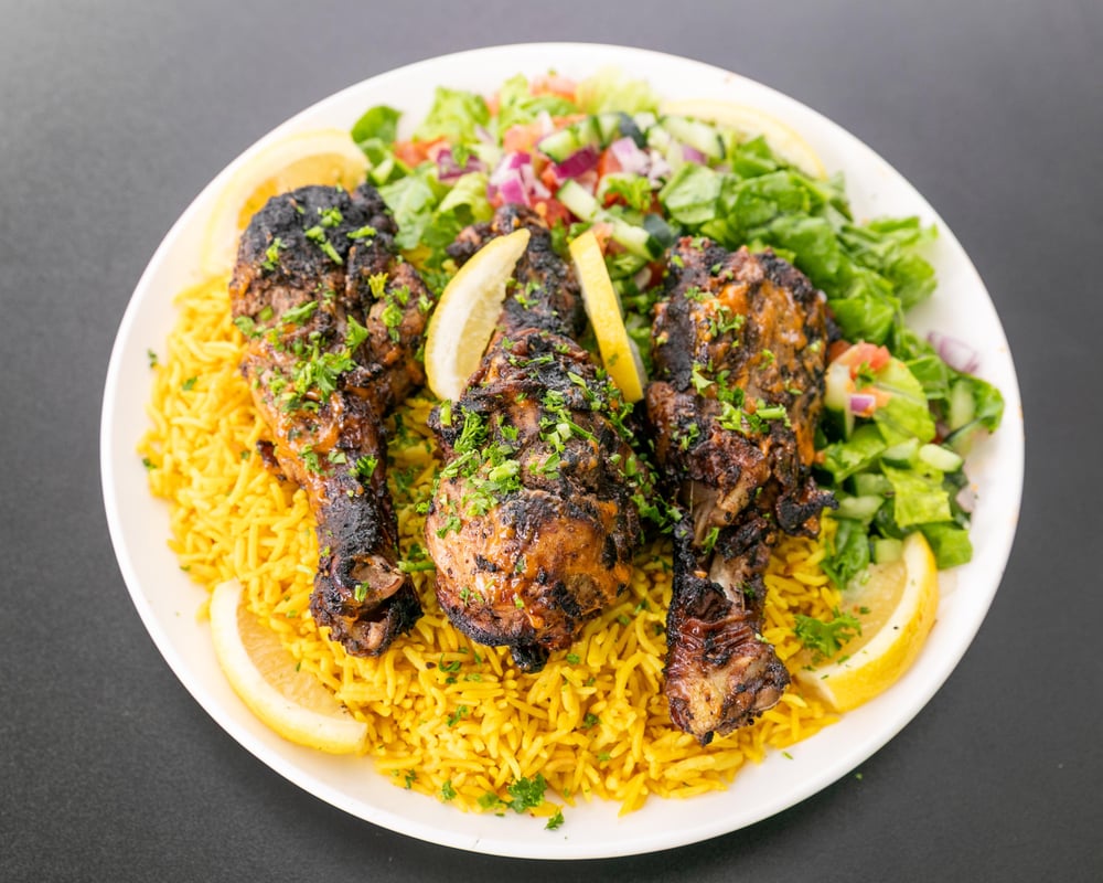 Large plate Jerk Chicken over rice and salad