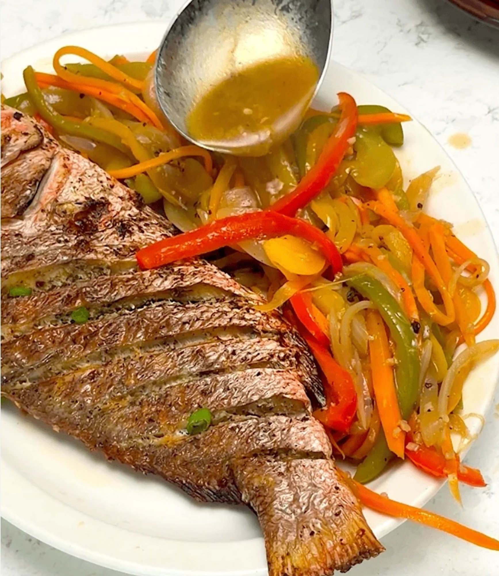 Snapper option 4 escovitch with carrots, bell peppers, onion, garlic in vinegar (done to order)