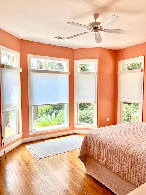 Add solar shades for a modern, bright appearance to your bedroom! These shades allow for ample privacy in this gorgeous Beaufort bedroom, while letting in the perfect amount of soft light.