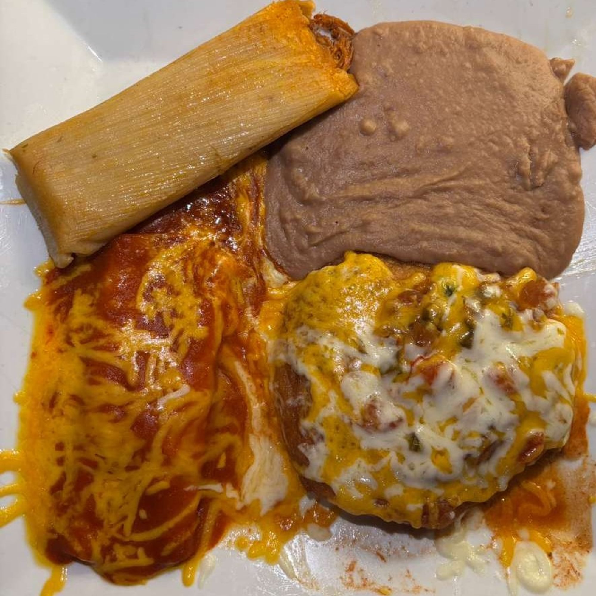 36. 1 Enchilada, 1 Tamale, 1 Chile Relleno and Refried Beans