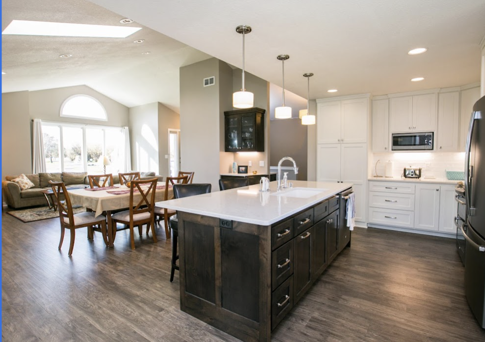 An open floor plan is designed for active families. The space is unobstructed by walls so the focus is an open kitchen, living, and dining areas.