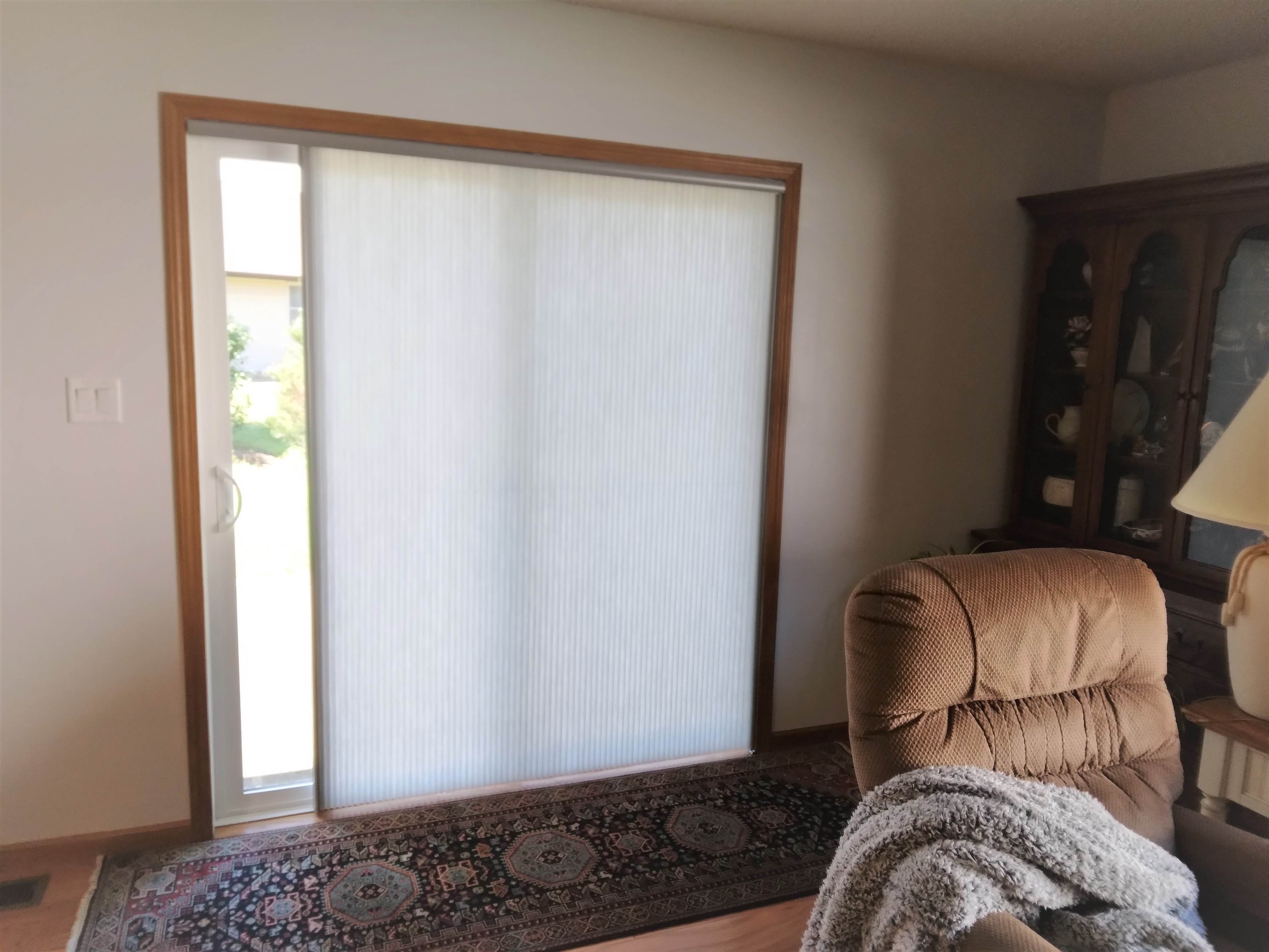 Vertical cellular window shades are a good option to cover doors, especially when matching existing cellular shades in the windows.  BudgetBlinds  Shades  Blinds  CellularShades  HoneycombShades  SpringfieldIllinois