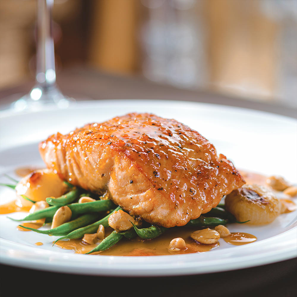 Seared Citrus Glazed Salmon with Marcona Almonds and Brown Butter.