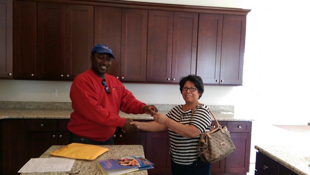 Sara getting the keys to her new home. Congratulation!!