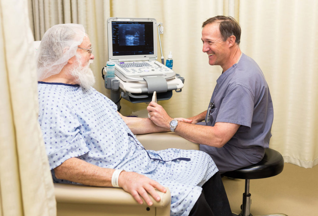 Dr. Ted Chambers and a patient at Montgomery Vascular Care