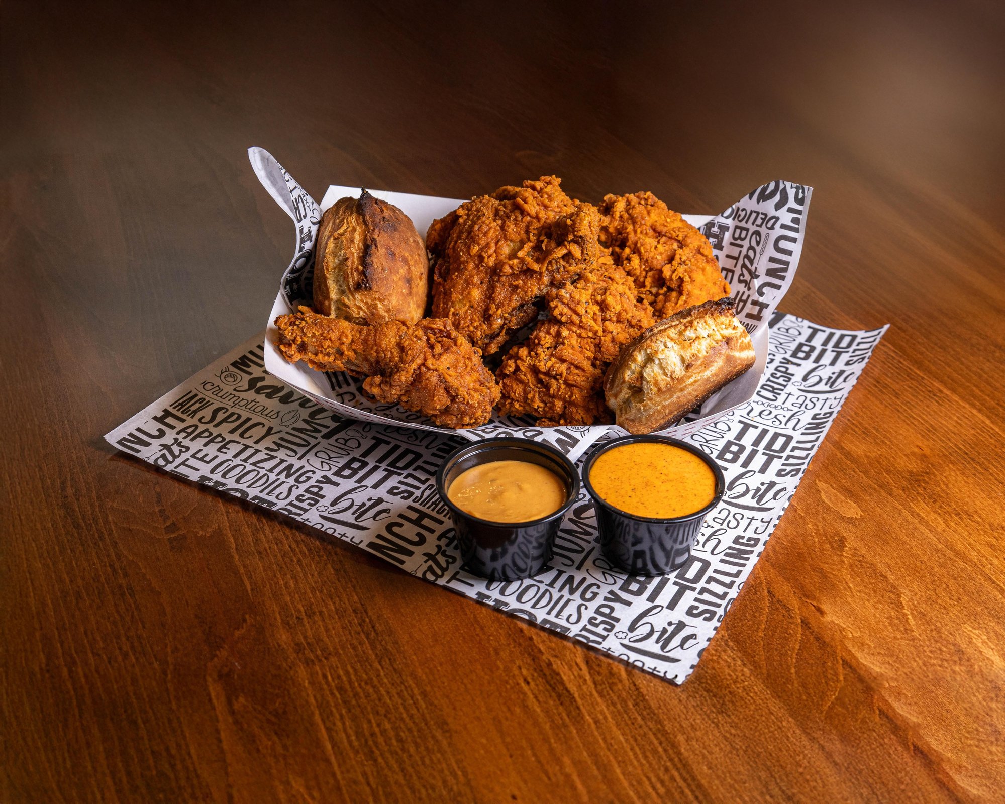 2 Pieces Tenders, 2 Piece Fried Chicken (Bone-In), 2 Sauces, 2 Rustic Butter Biscuits