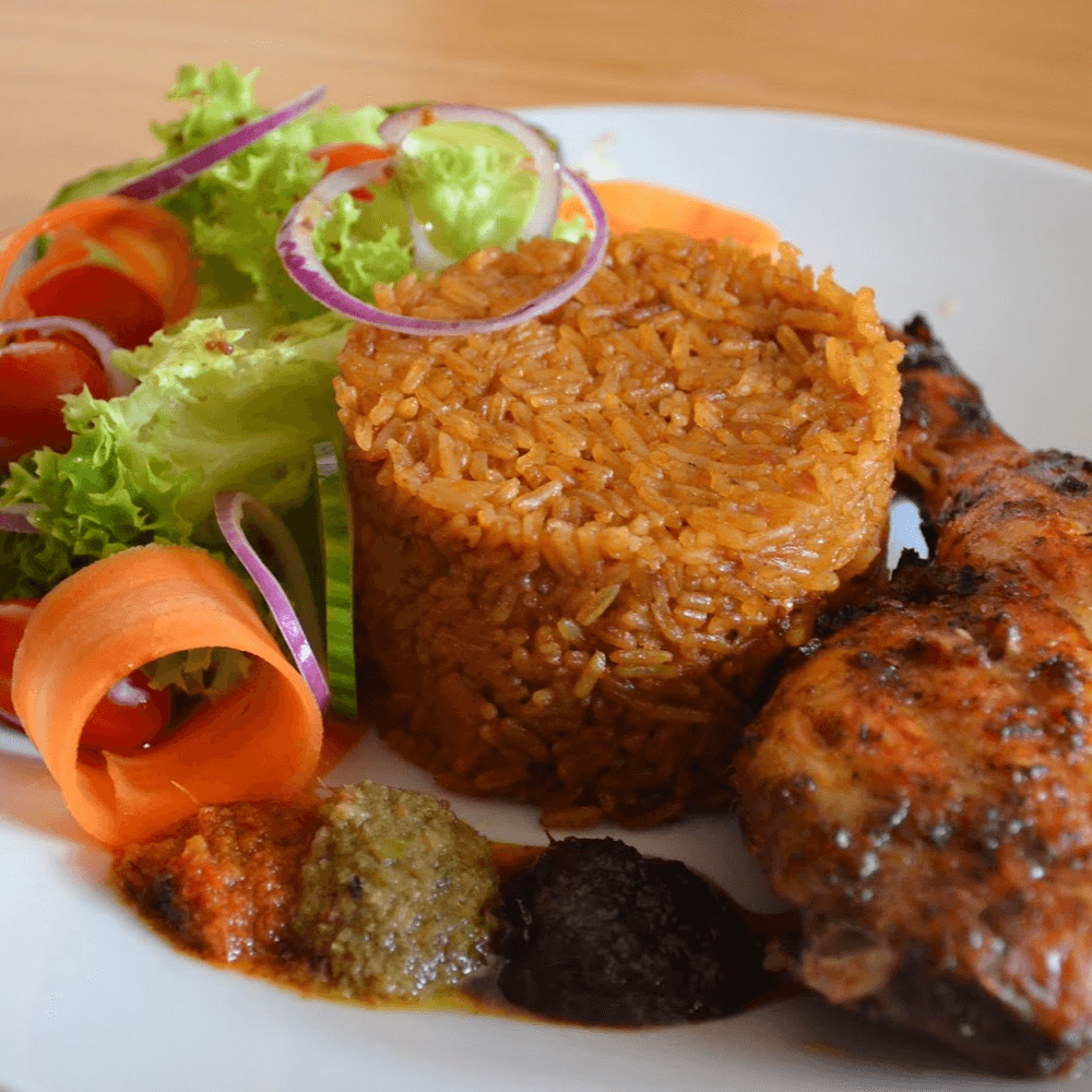 Jollof Rice With 2 Pc Chicken/ Fish