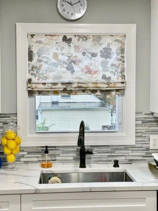 Love this washed out floral Roman shade for this kitchen...so . Makes washing dishes so much better.