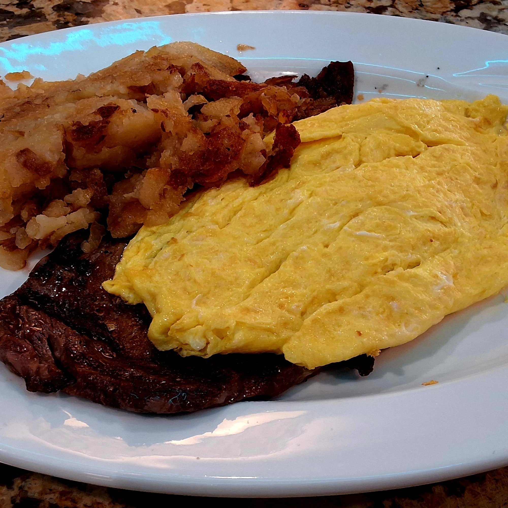 Rib-Eye Steak and Three Eggs