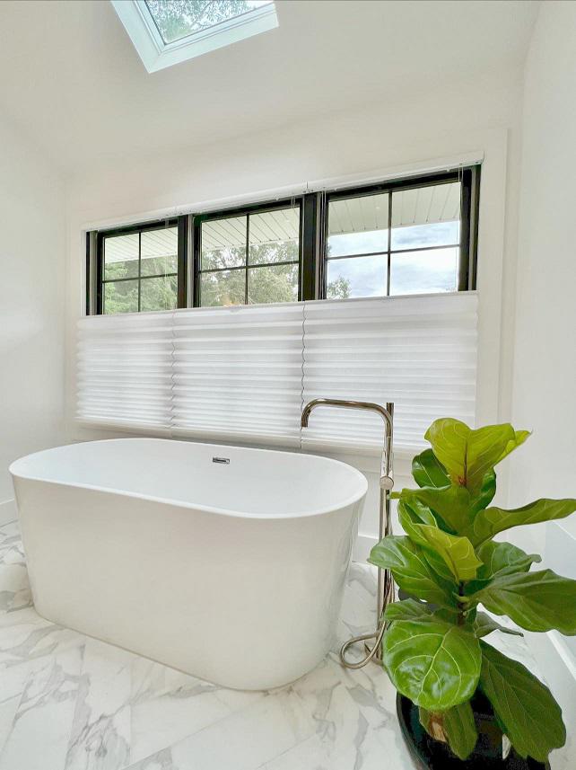 Simple & chic. We love this white bathroom with TDBU shades for maximum light & privacy from the neighbors.