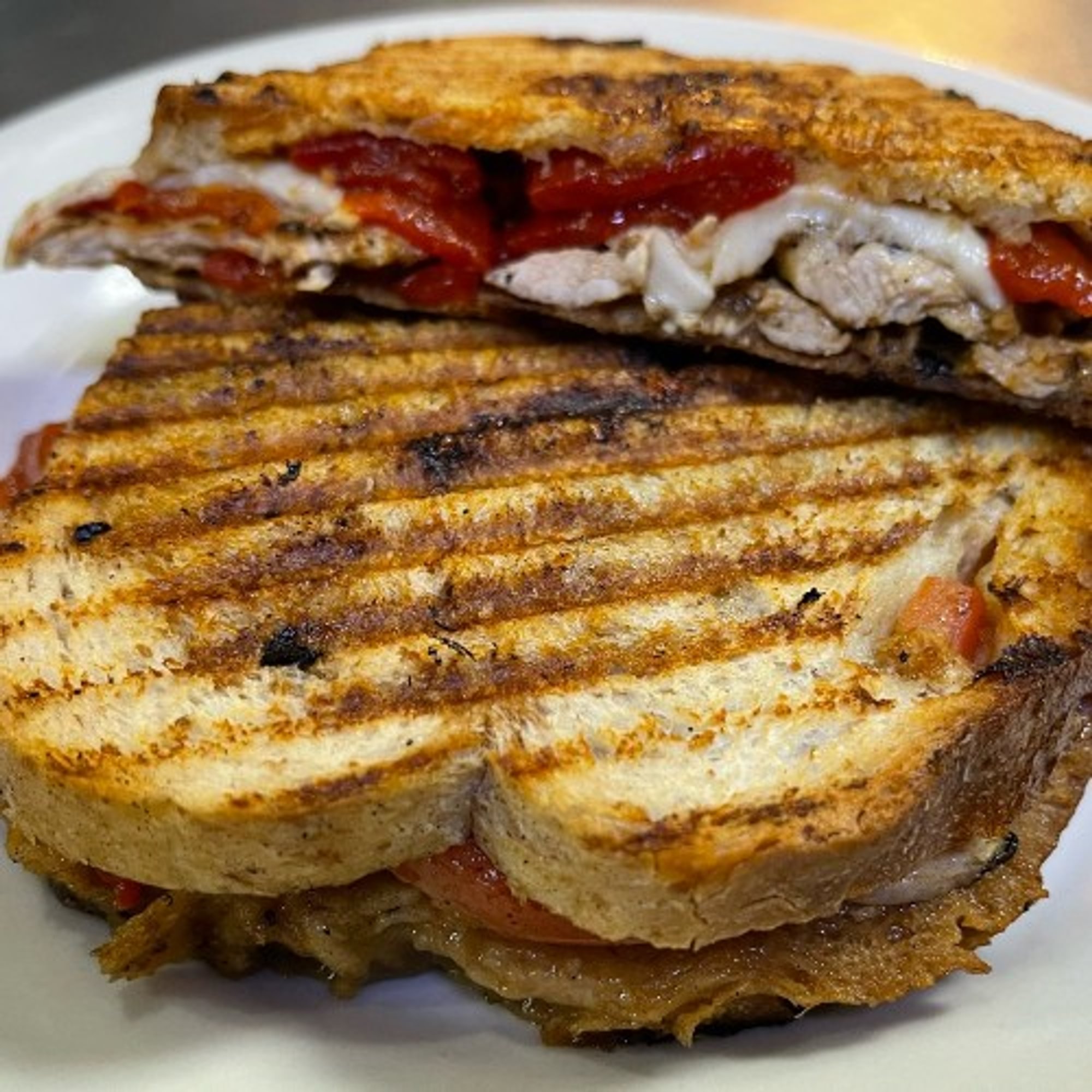 Grilled Chicken Supreme Panini .