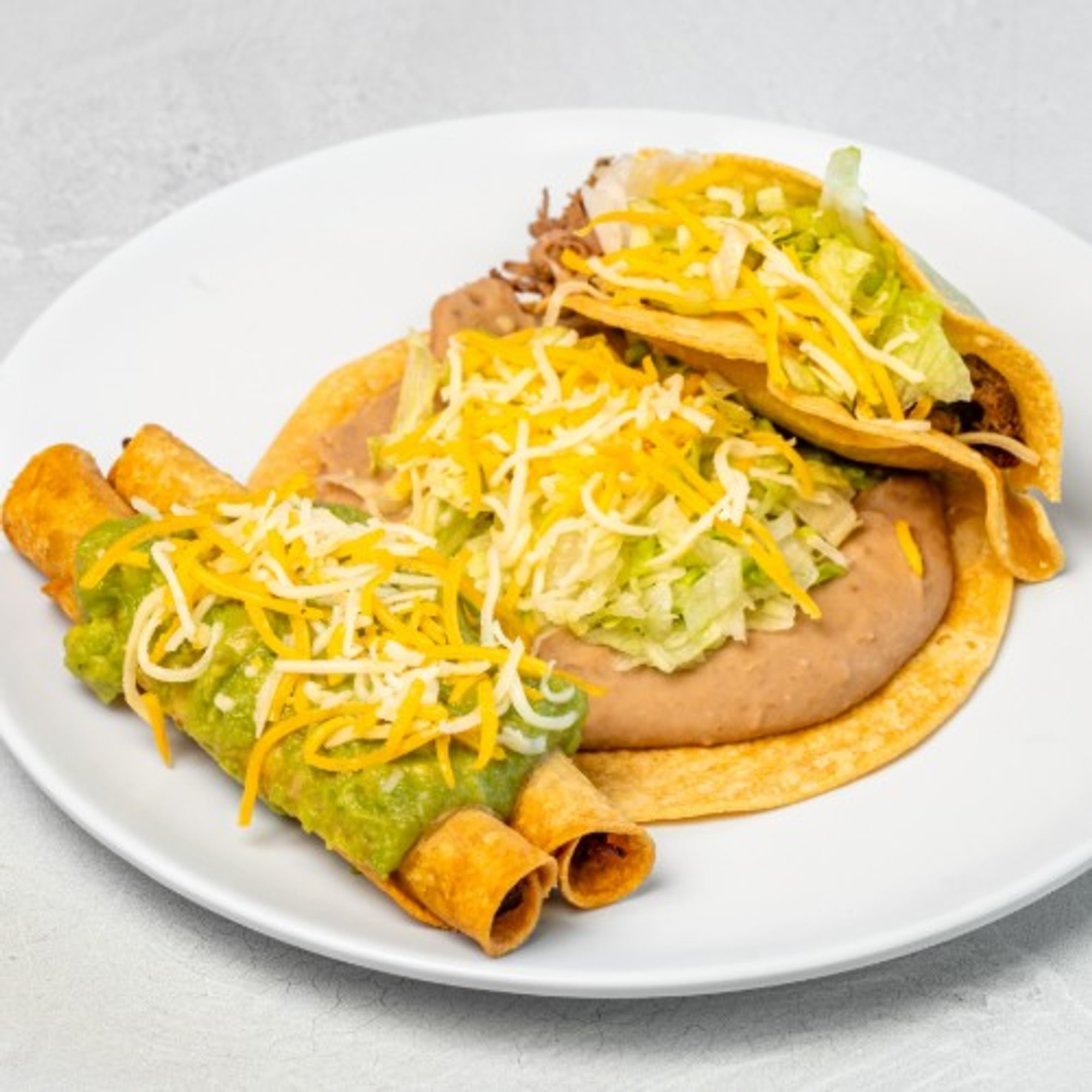 Bean Tostada, 1 Beef Taco, & 2 Rolled Tacos (Special #2)