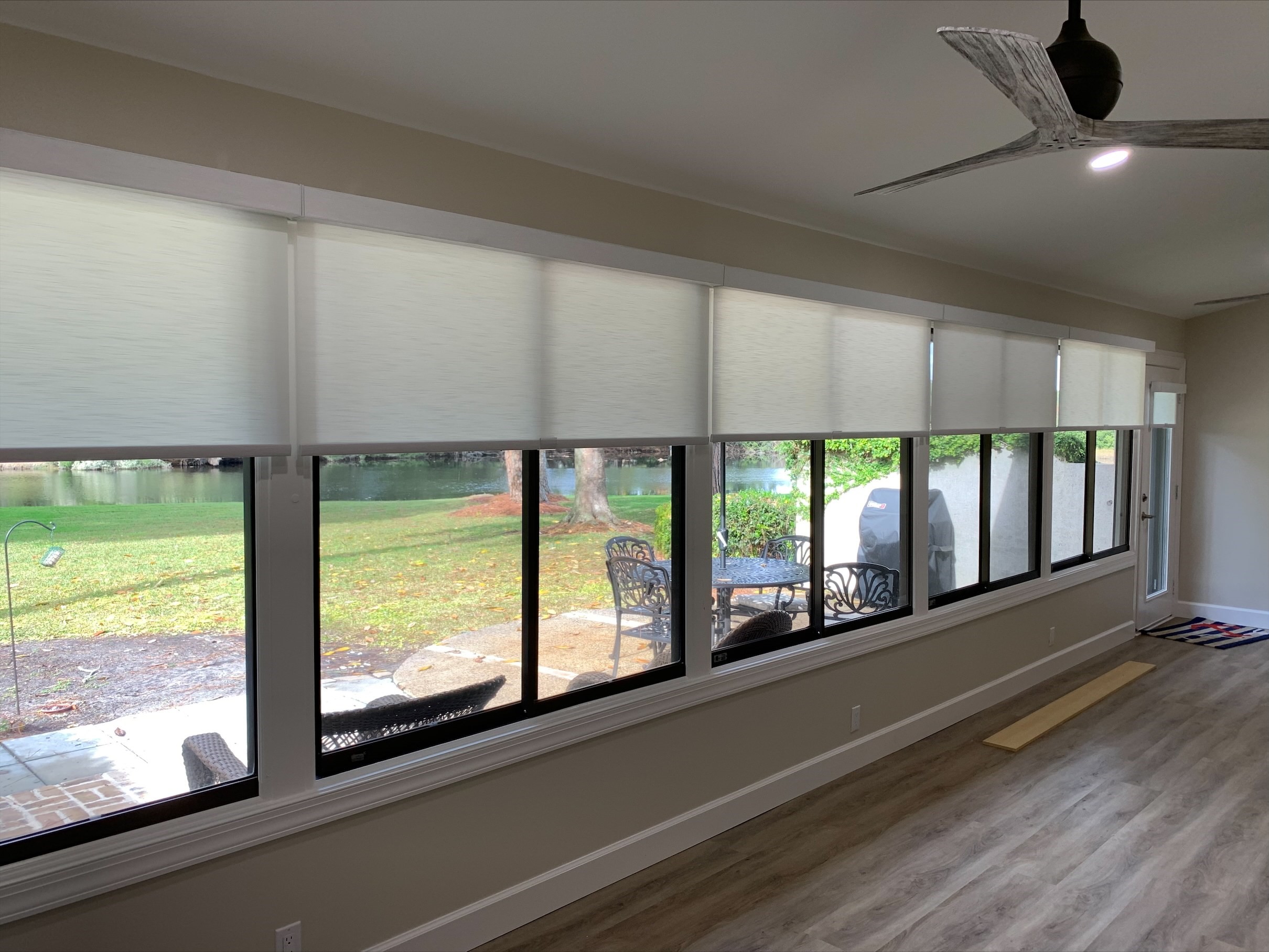 Cordless roller shades create a clean look in the window. They don't take away from your view when you have them all the way up but can provide the privacy you desire when completely down!