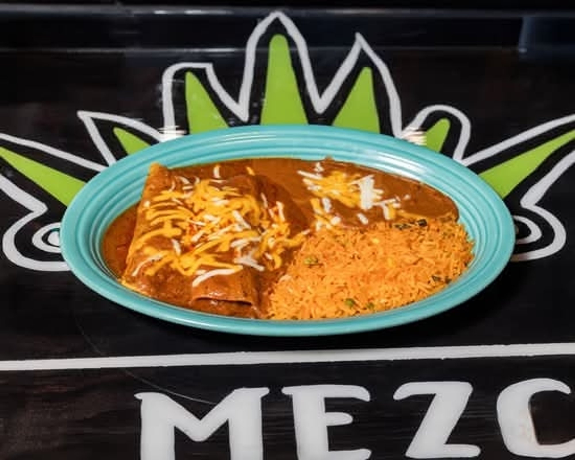 Two Enchiladas, Rice and Fried Beans