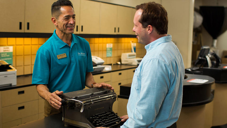 Customer dropping off typewriter to be packed and shipped