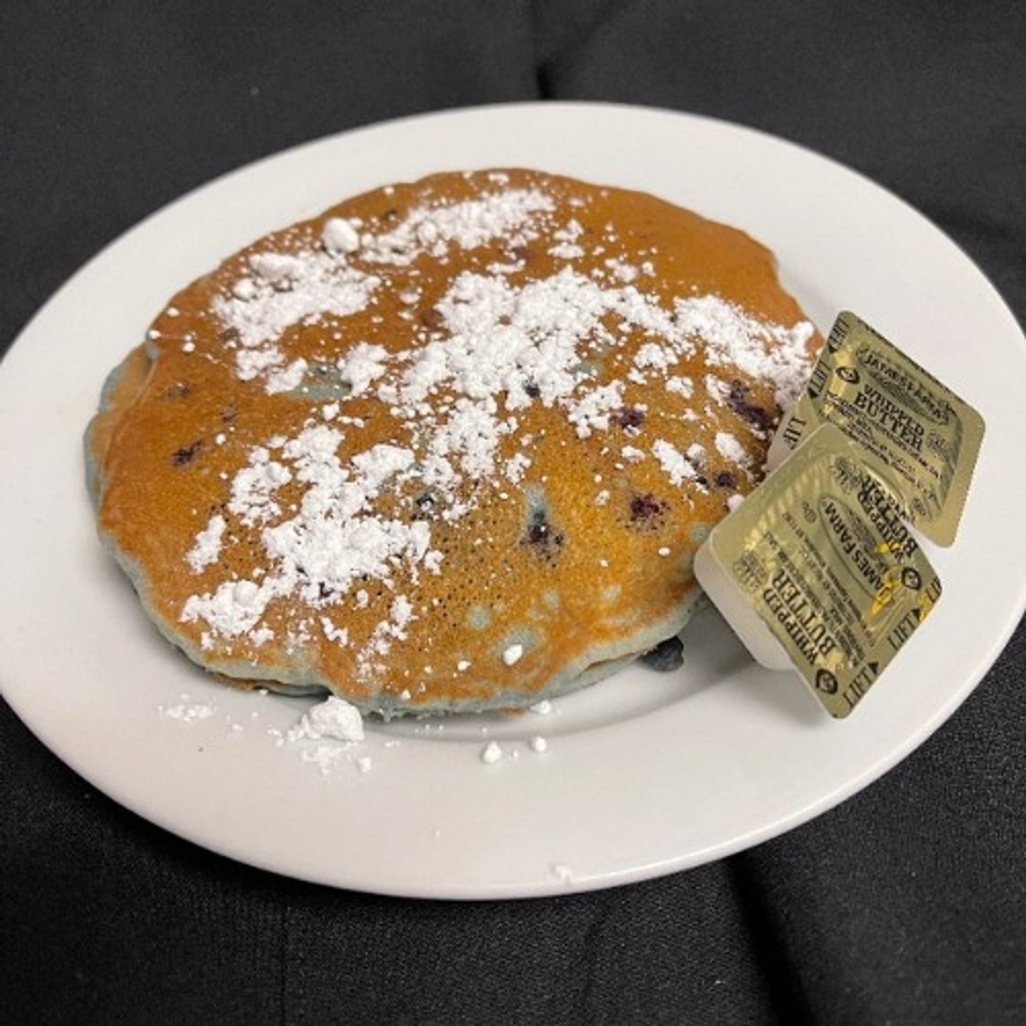 3 Blueberry Pancakes Dusted with Powdered Sugar