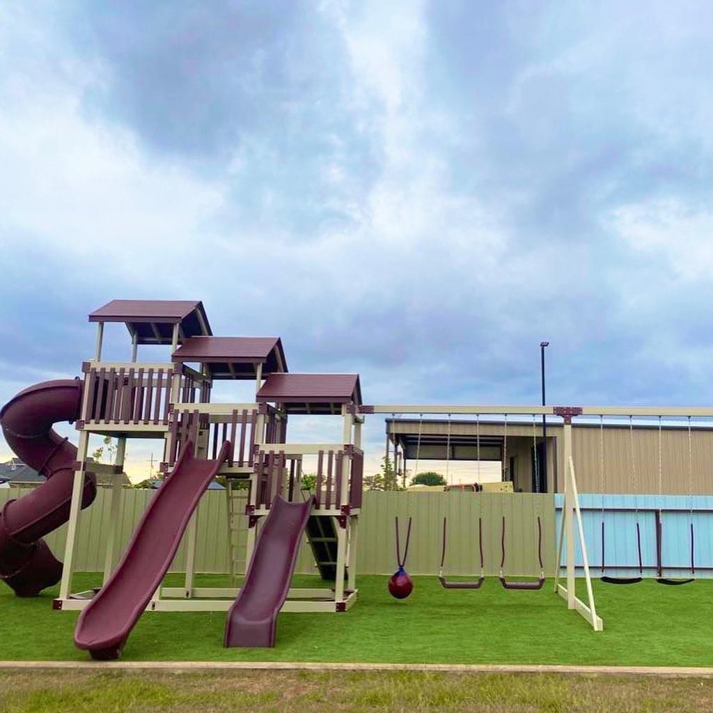 Triple tower with swing set with slides, swings, and gang plank.