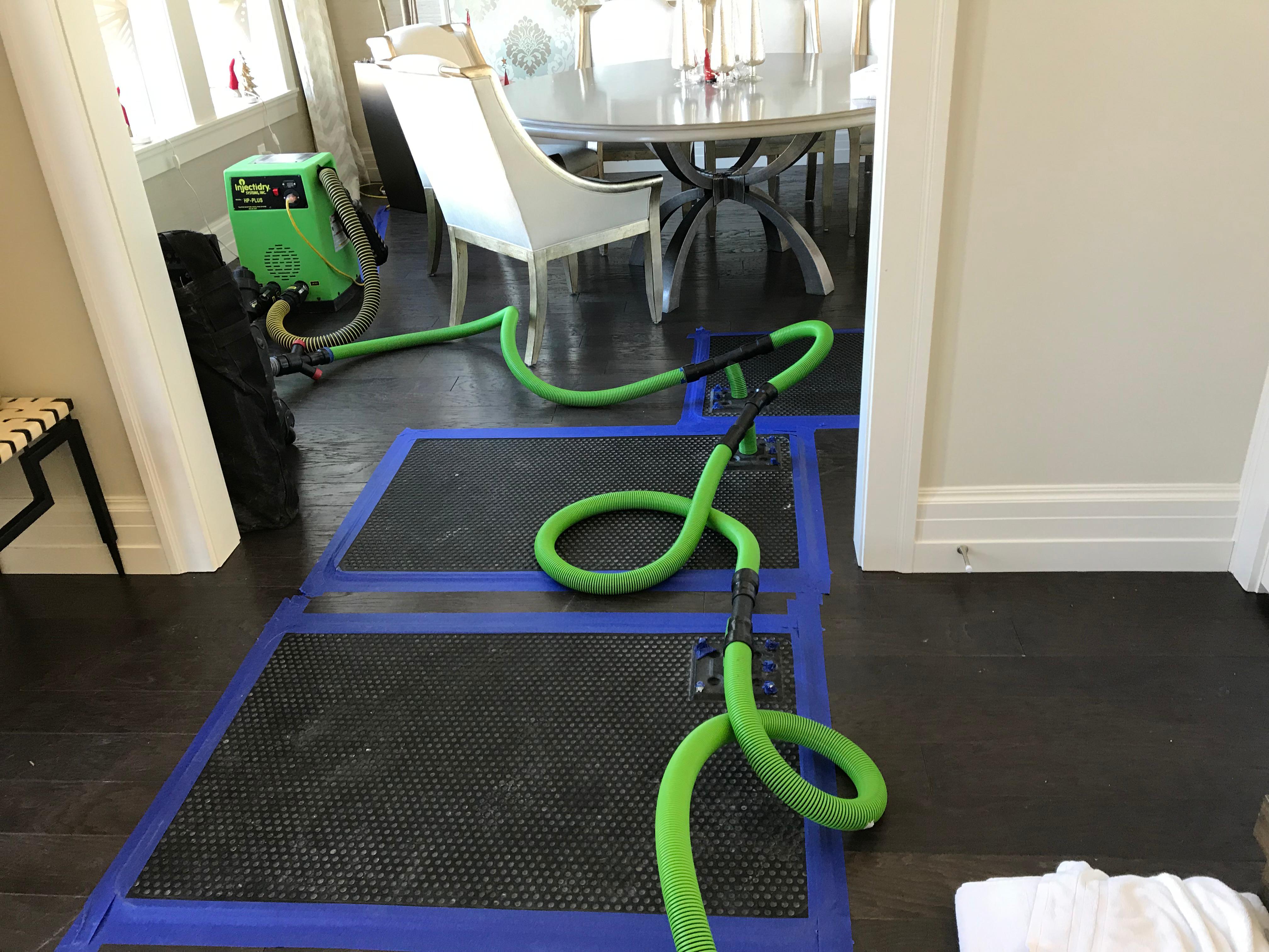 Our SERVPRO of South Jordan/ North Draper team working on a residential water damage restoration after a water leak in the kitchen and living room of a local home.