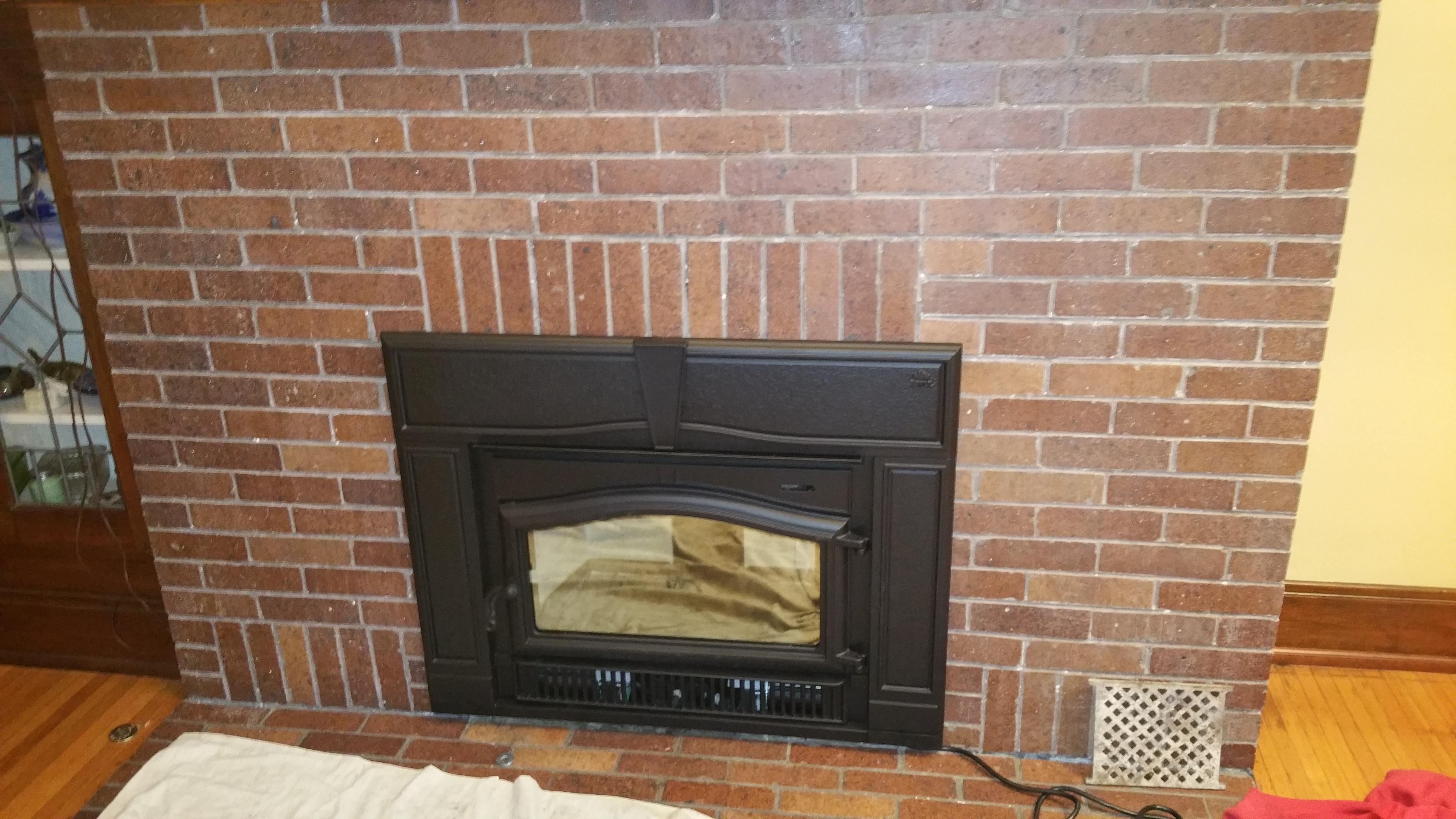 Dave and I installed this wood burning insert into an existing masonry fireplace and added a stainless steel chimney liner