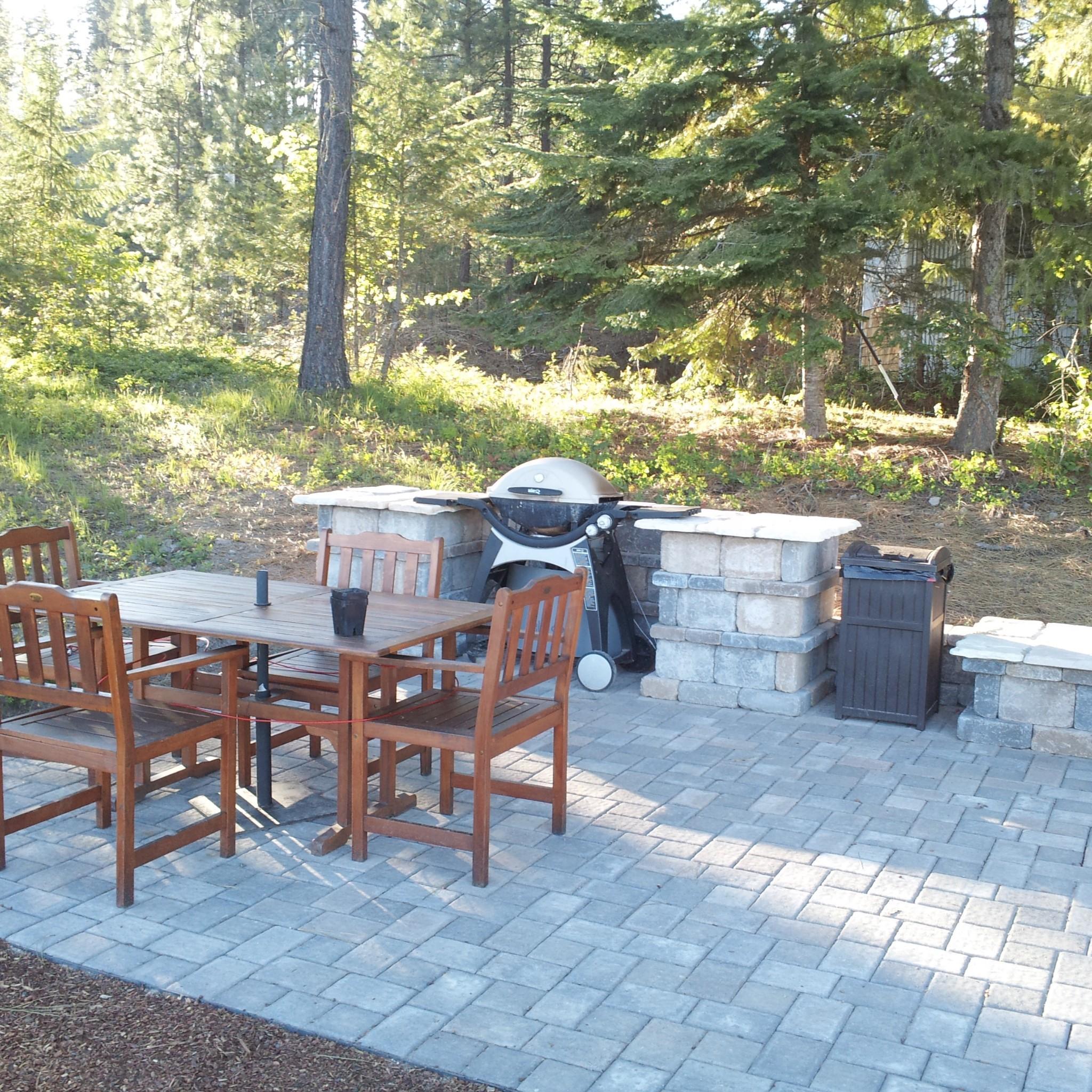 Outdoor living a 20 x 20 paver patio with a tumble stone barbecue area. 2013
