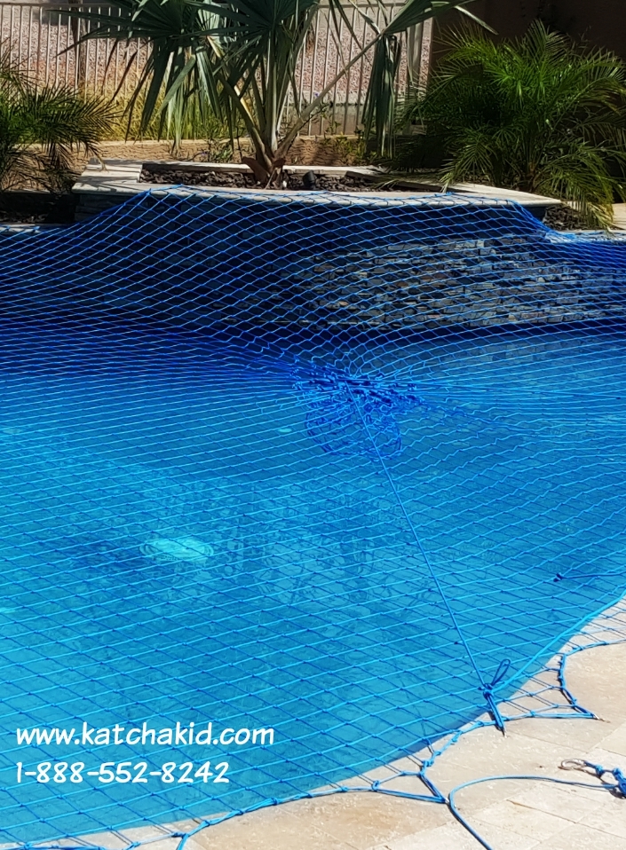 Multi-level pools with custom features can still be securely covered by a Katchakid pool safety net.