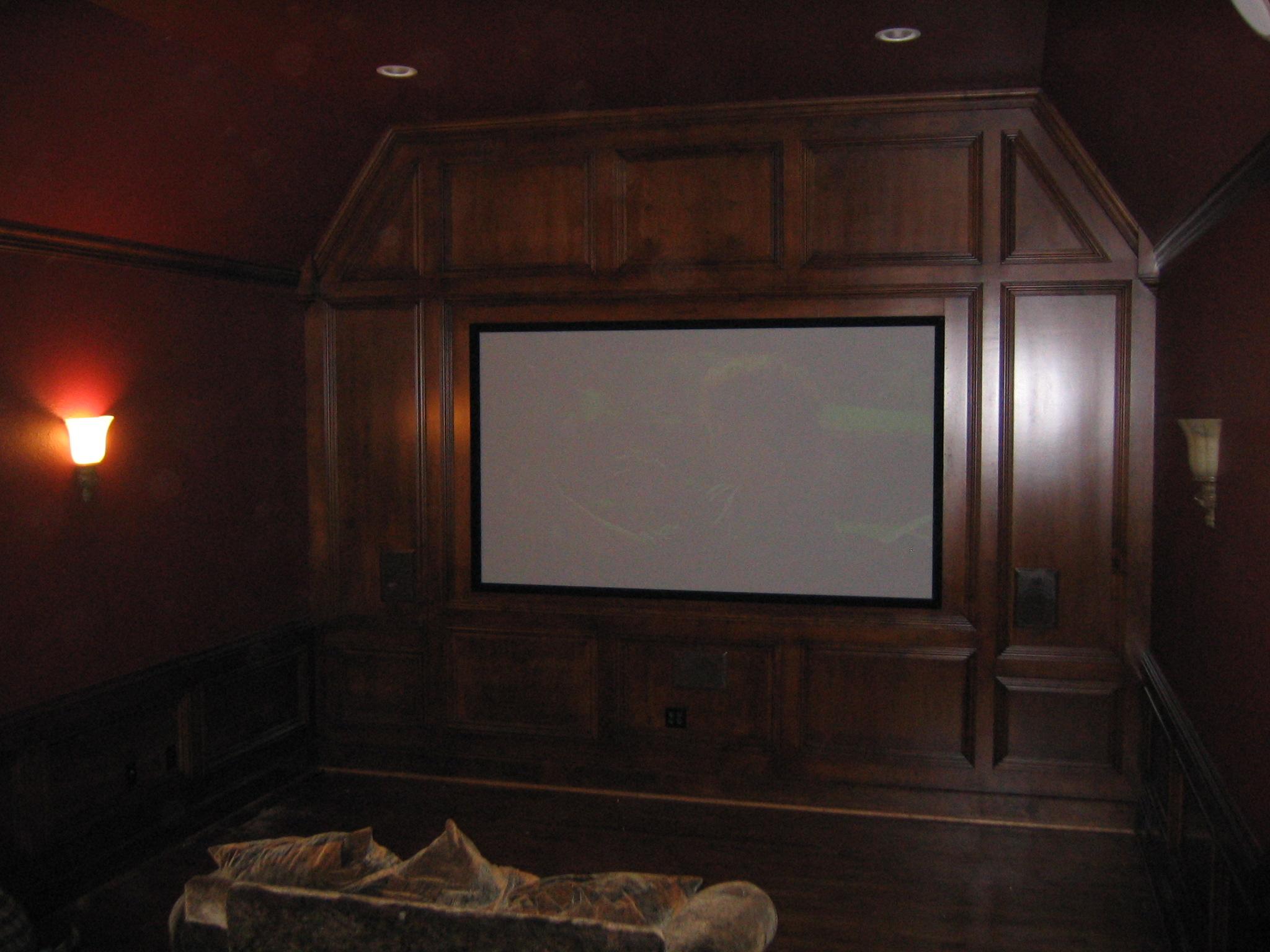 5.1 surround sound with Klipsch R-5800 W in-wall speakers and a massive projector and screen.