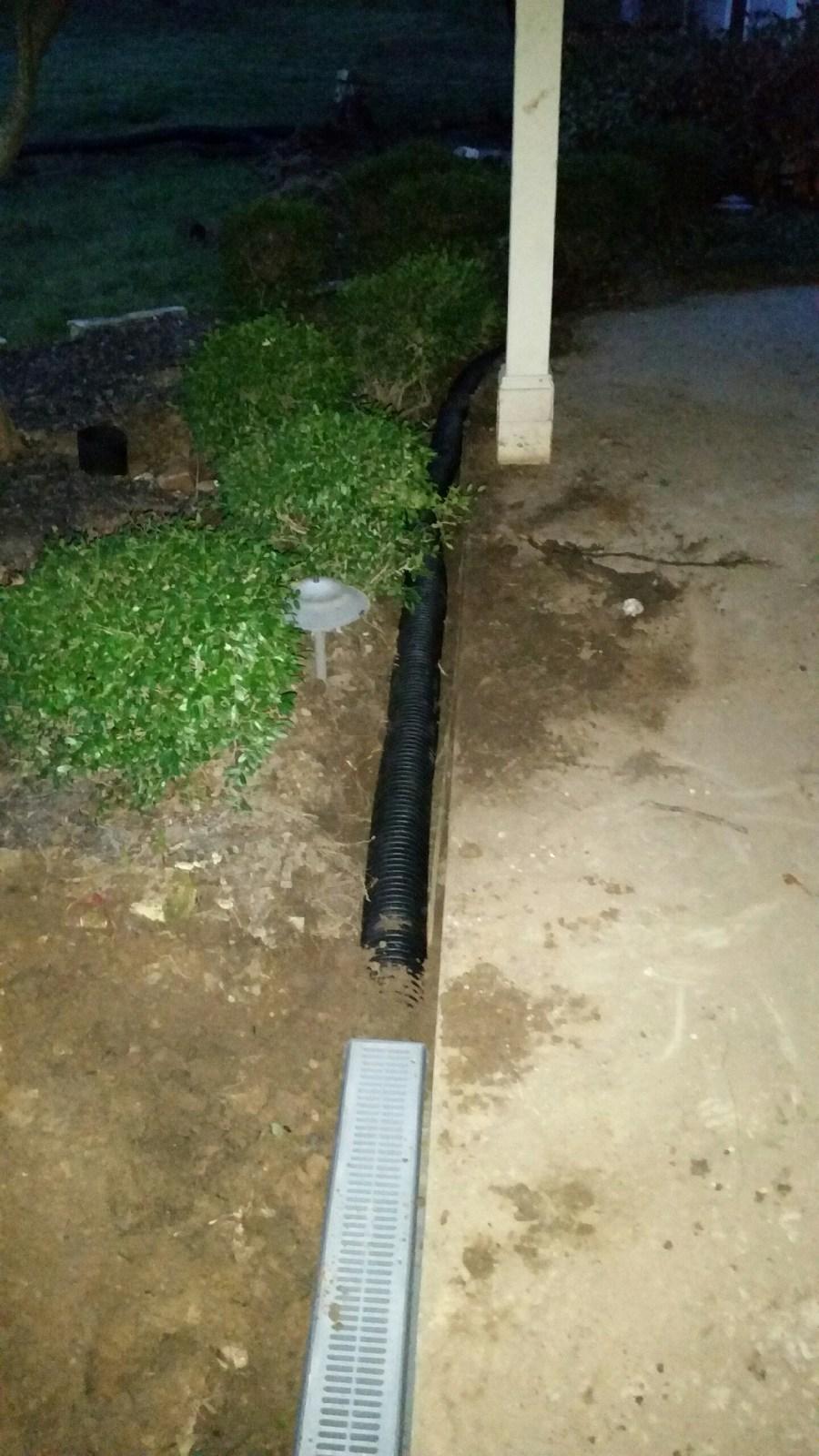 This patio used to flood every time it rained.  We installed new french drains and box drains to stop the water from flooding the house.