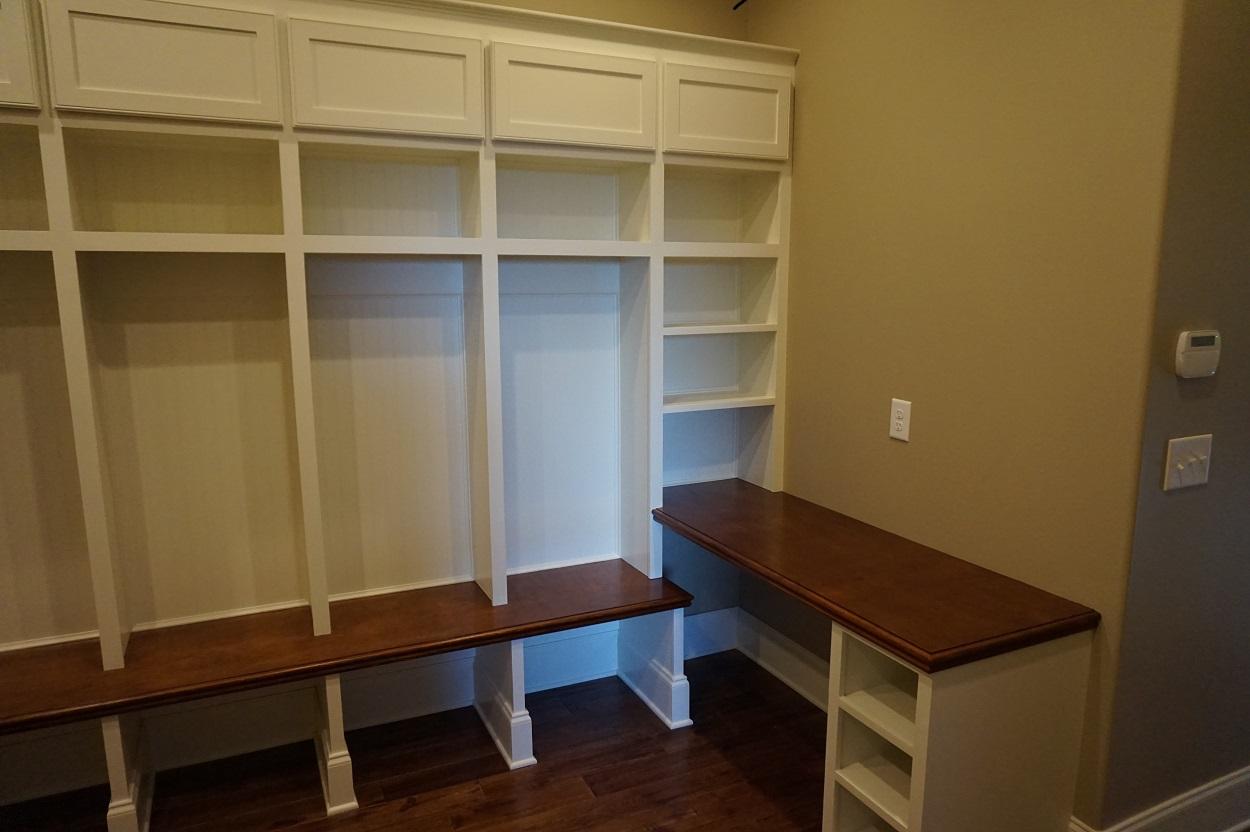 Having a great area to catch all the shoes, books and coats is a must!  The owner wanted to be organized, so we put our thinking hats on and began to design this completed product.  Beautiful work by our finish carpenter and painter!