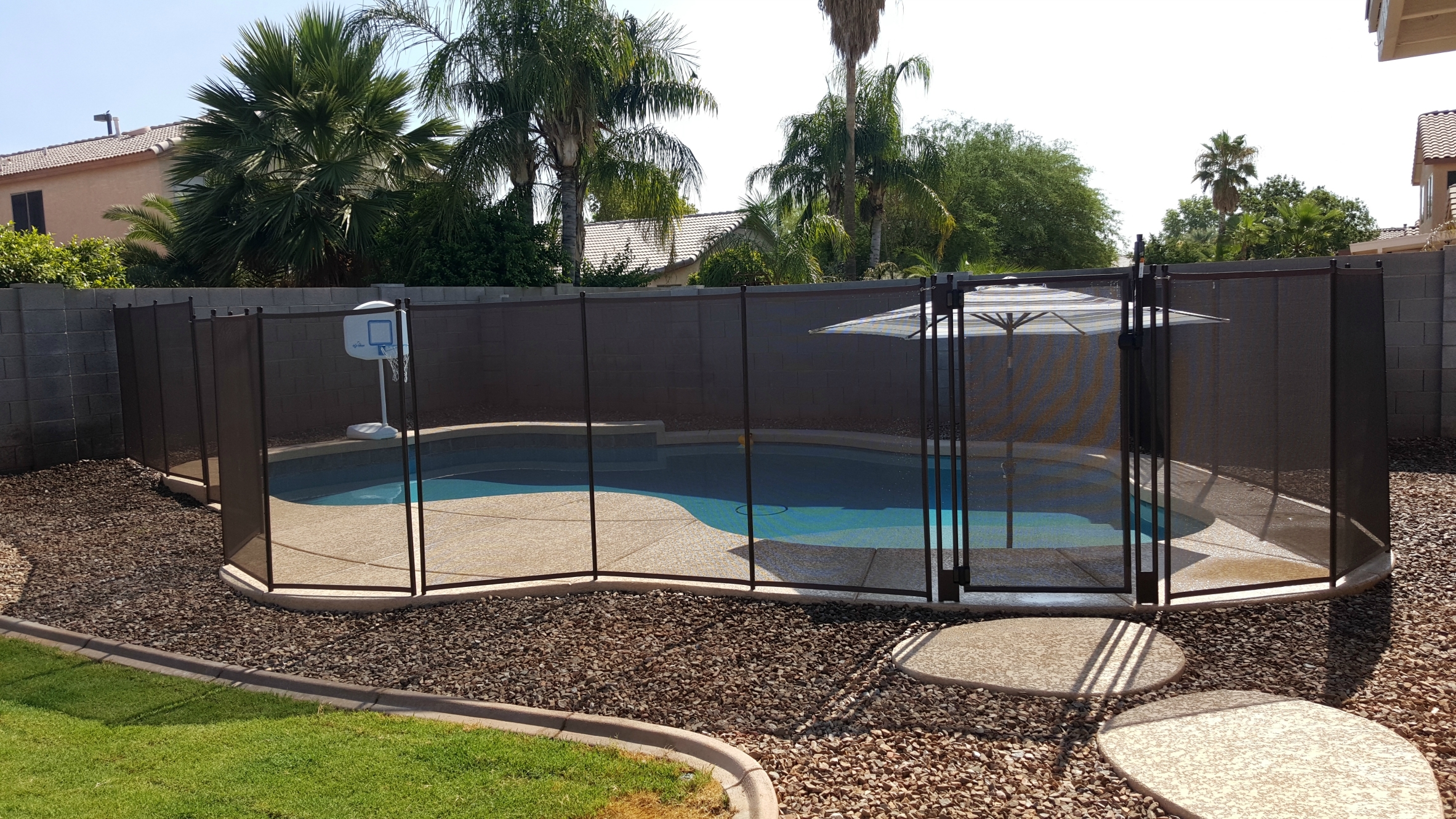 Custom mesh fence and gate with a lock.