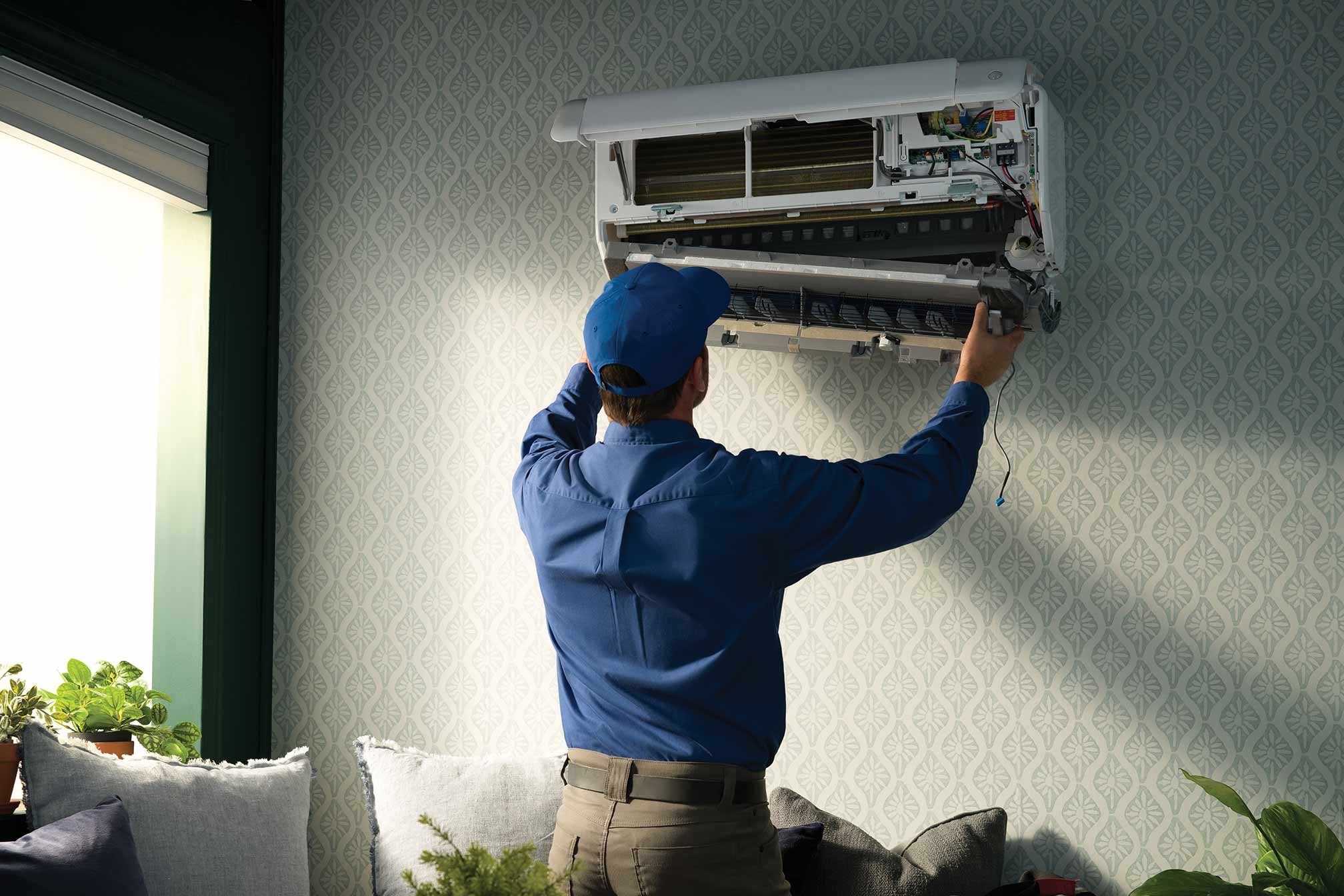 A carrier dealer performing a ductless mini split repair