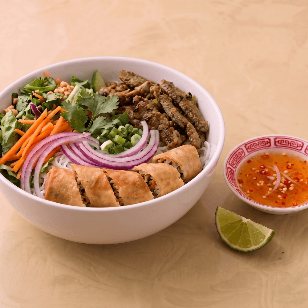 Grilled Lemongrass Sliced Beef and Egg Roll Vermicelli Bowl