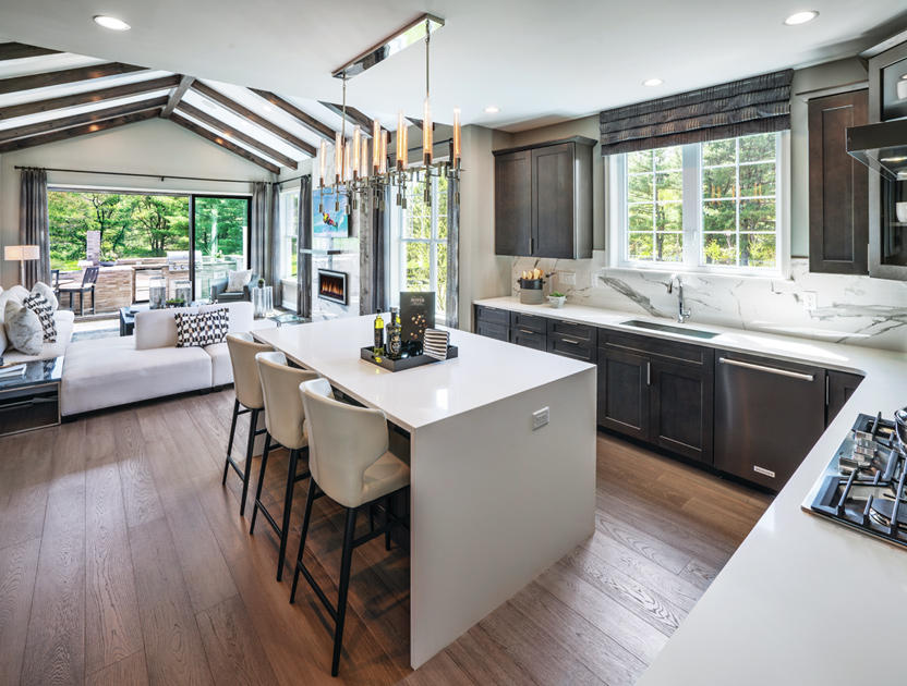 Kitchen open to great room with slider to outdoor living