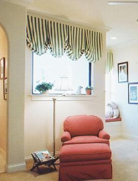 Stripes accent the window and bring it into the decor of the  room