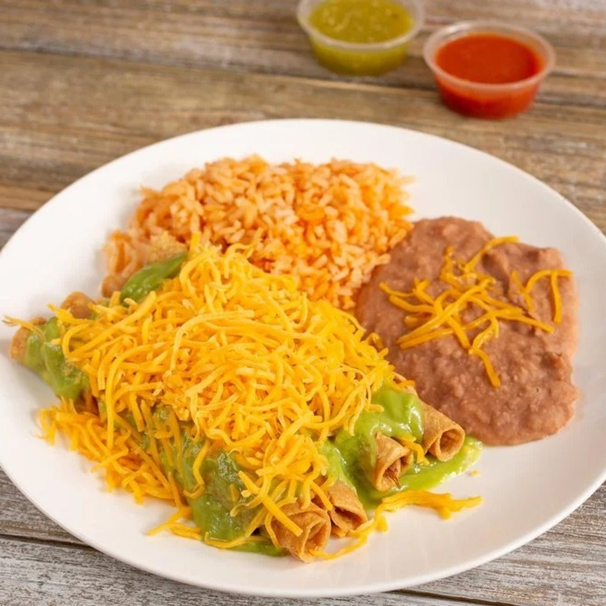 4 Rolled Tacos, Rice, Beans and a drink
