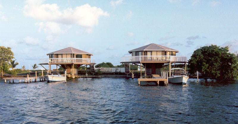 Cantilevered over the water's edge and overlooking the Caribbean Sea on a small private Cay in Belize, these Topsider hurricane-resistant pedestal homes make for the perfect tropical vacation getaway.