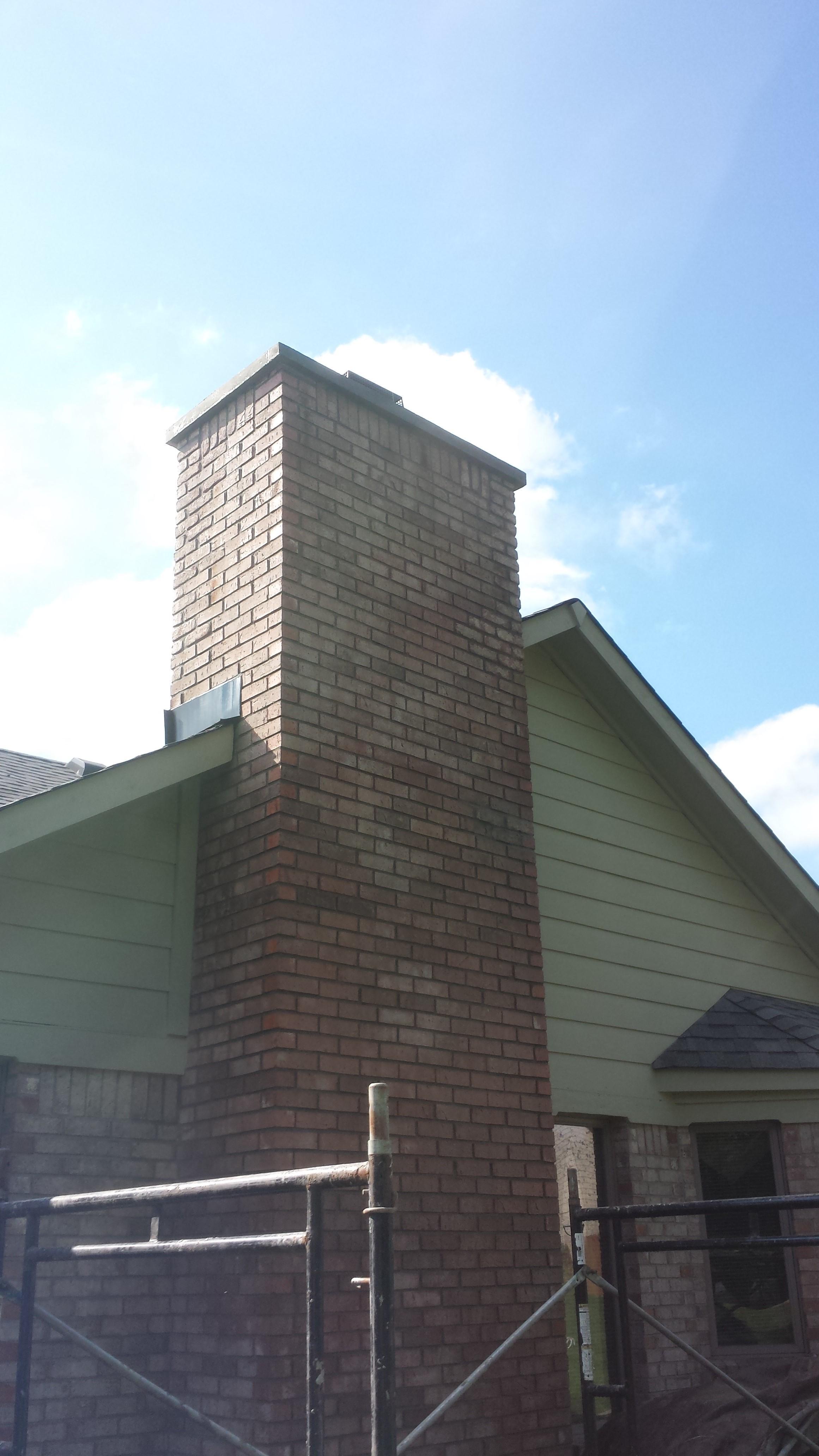 We removed all bad brick, removed metal cap and poured concrete cap that overhangs 