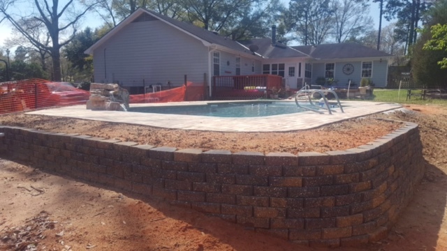 Mag-Nificent Pools Inc Logo