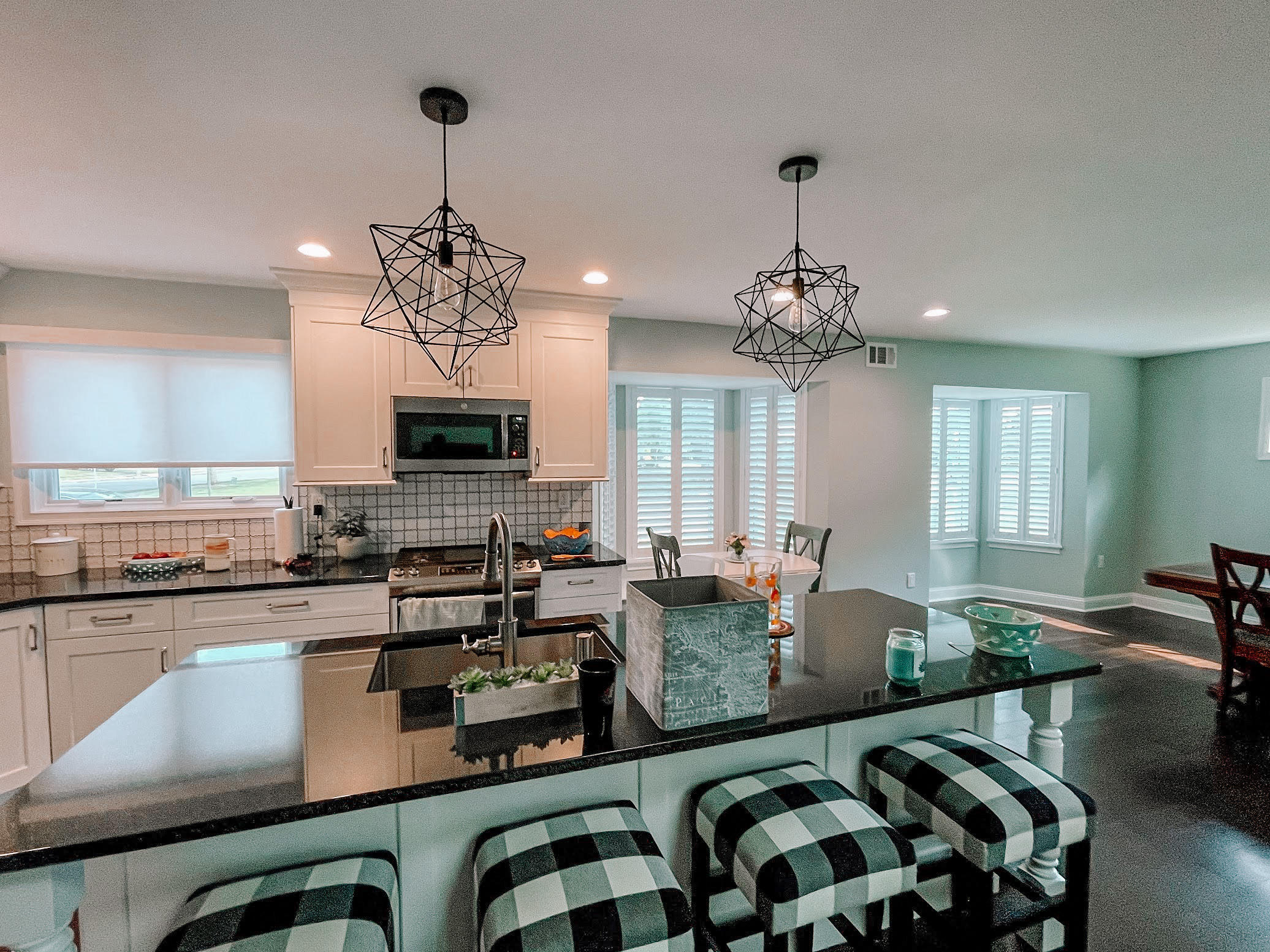 Roller Shades and Shutters add to the clean, bright look of this kitchen in Marlboro, NJ.