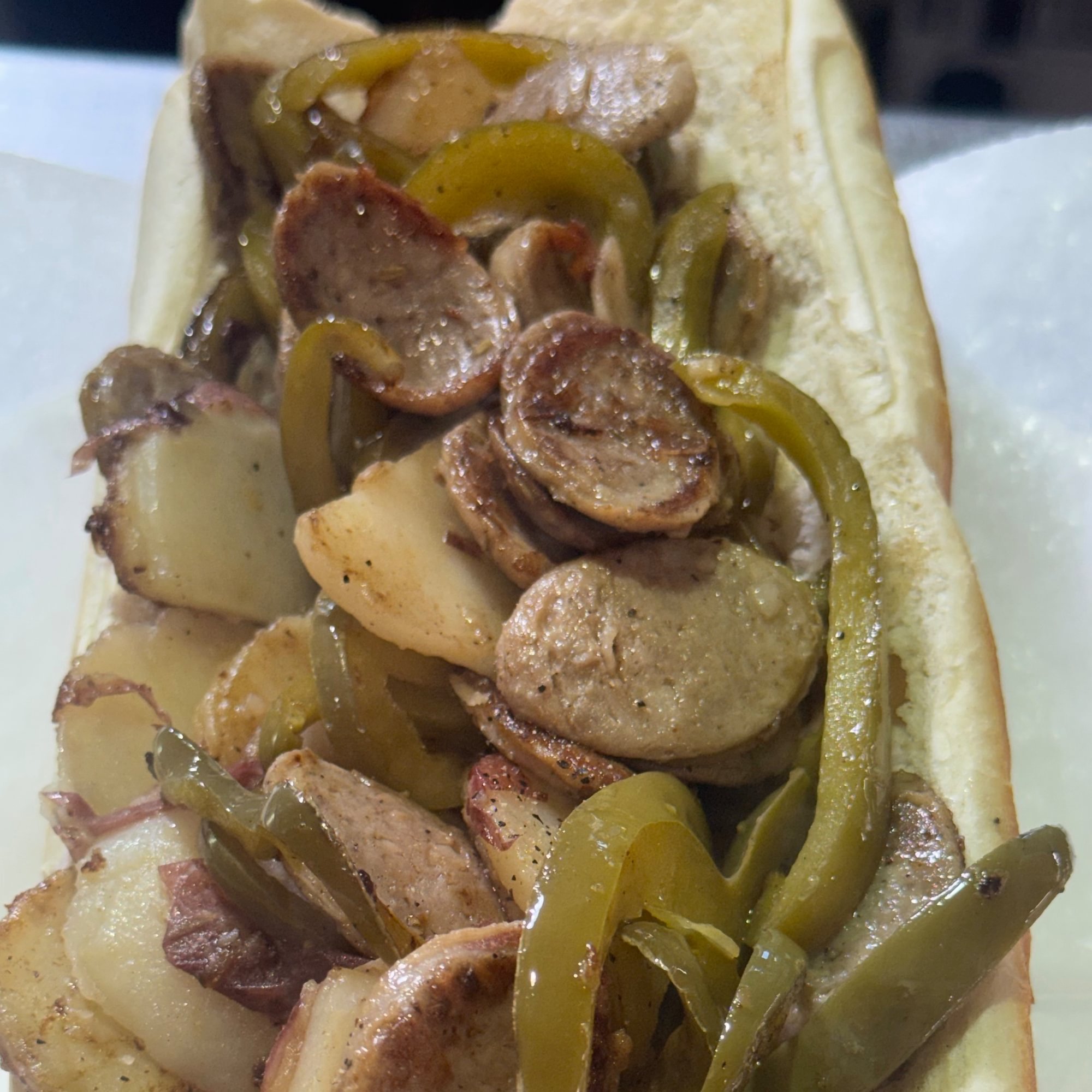 Italian Sausage with homemade vinegar peppers and sliced Red Bliss Potatoes sub
