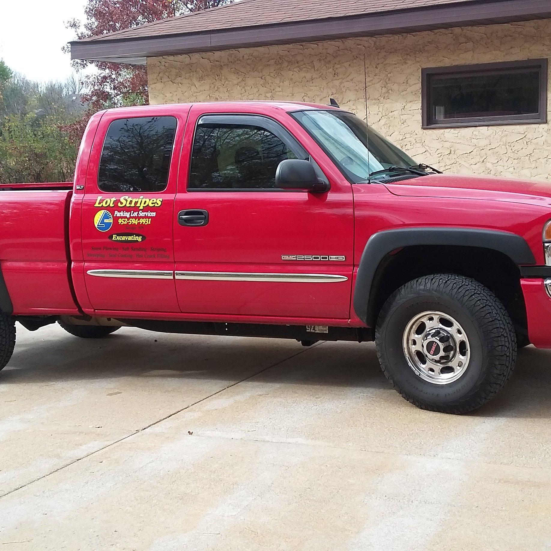 Lot Stripes( parking lot services) Logo