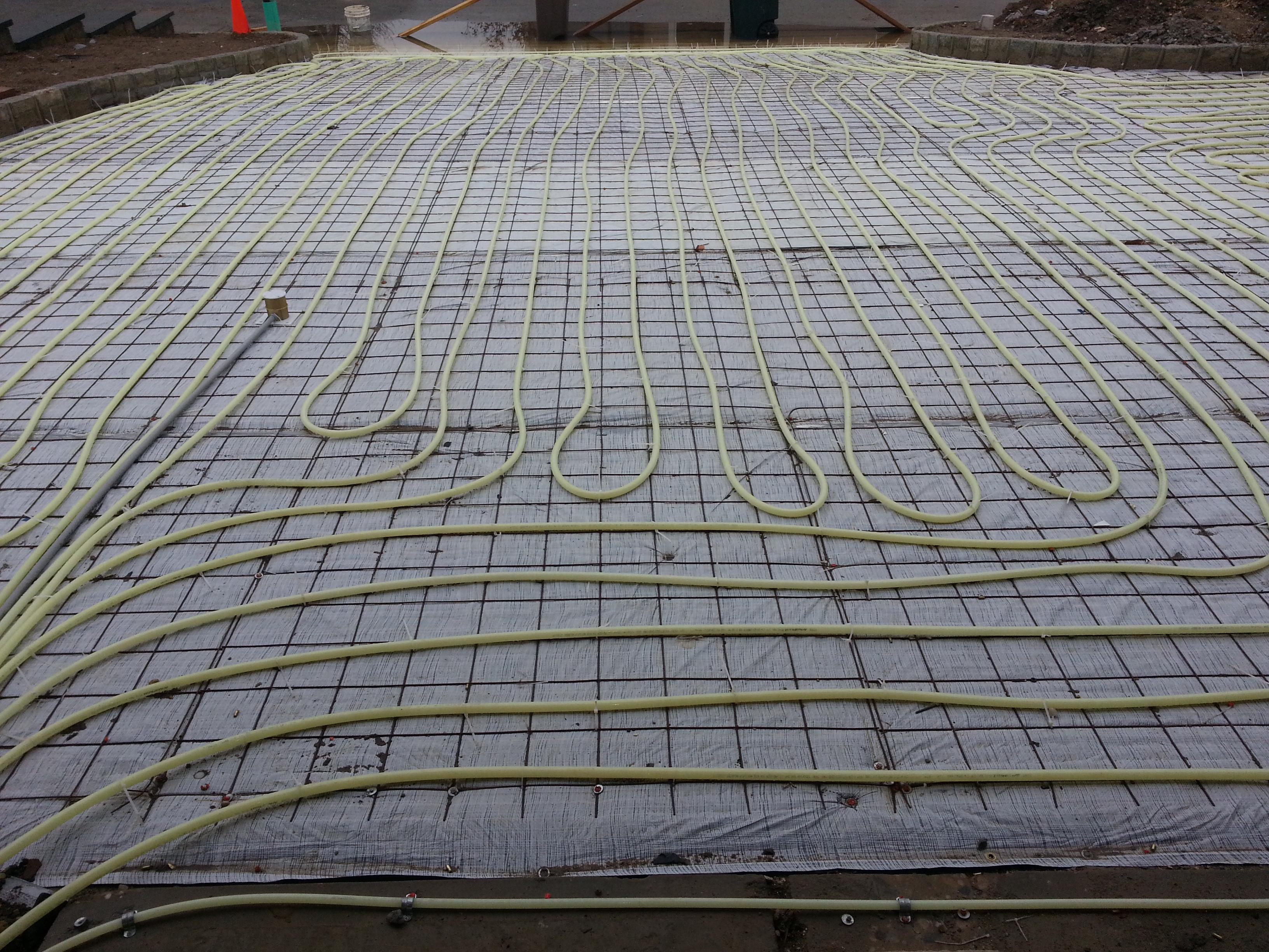 Here is how the tubing is laid before the driveway is poured.