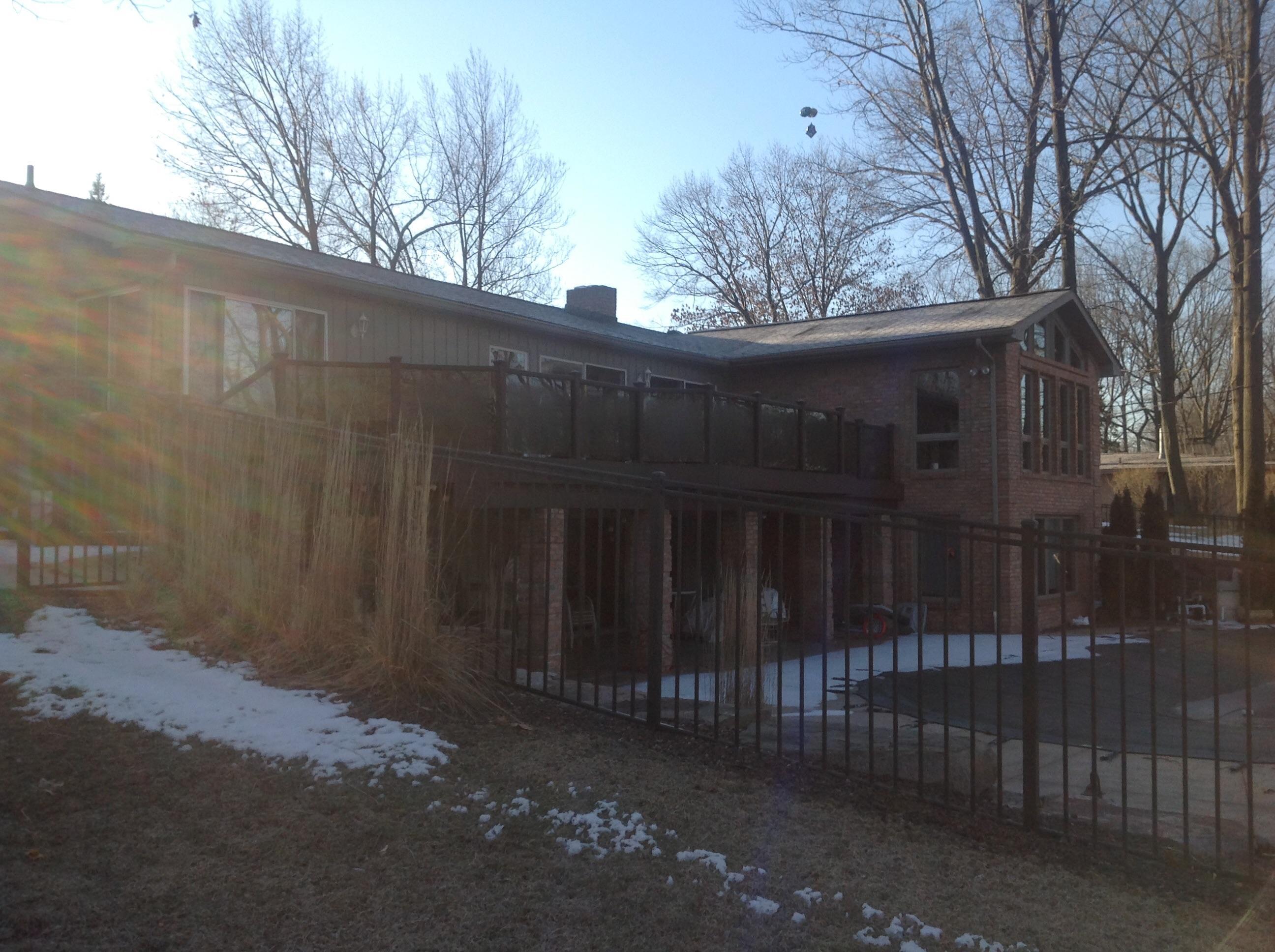This deck showcases many different skills. We combined diagonal decking with boarders. This is a Trex deck with tinted tempered glass panels for the railings.