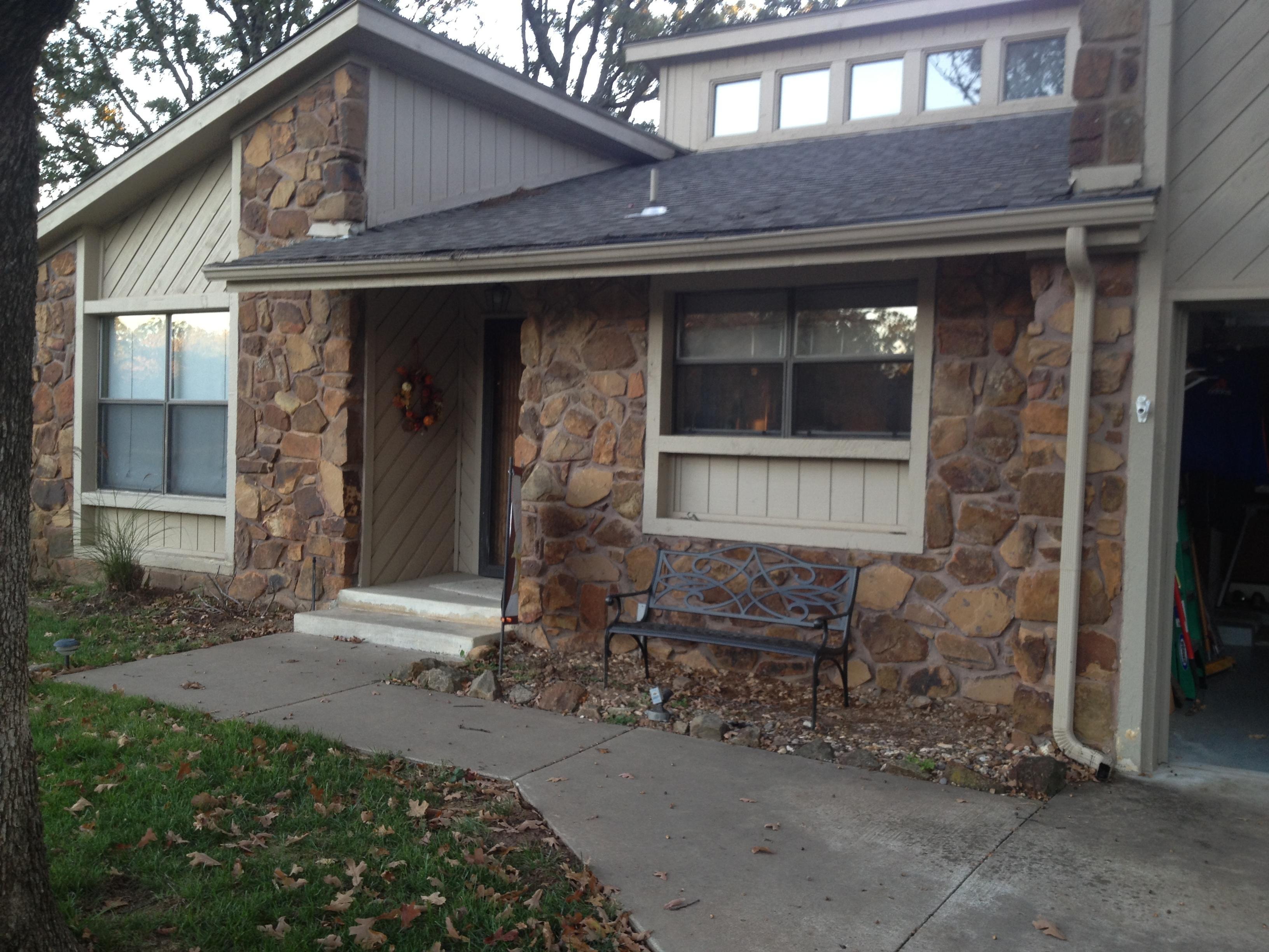 Before picture of and exterior repaint including rock 