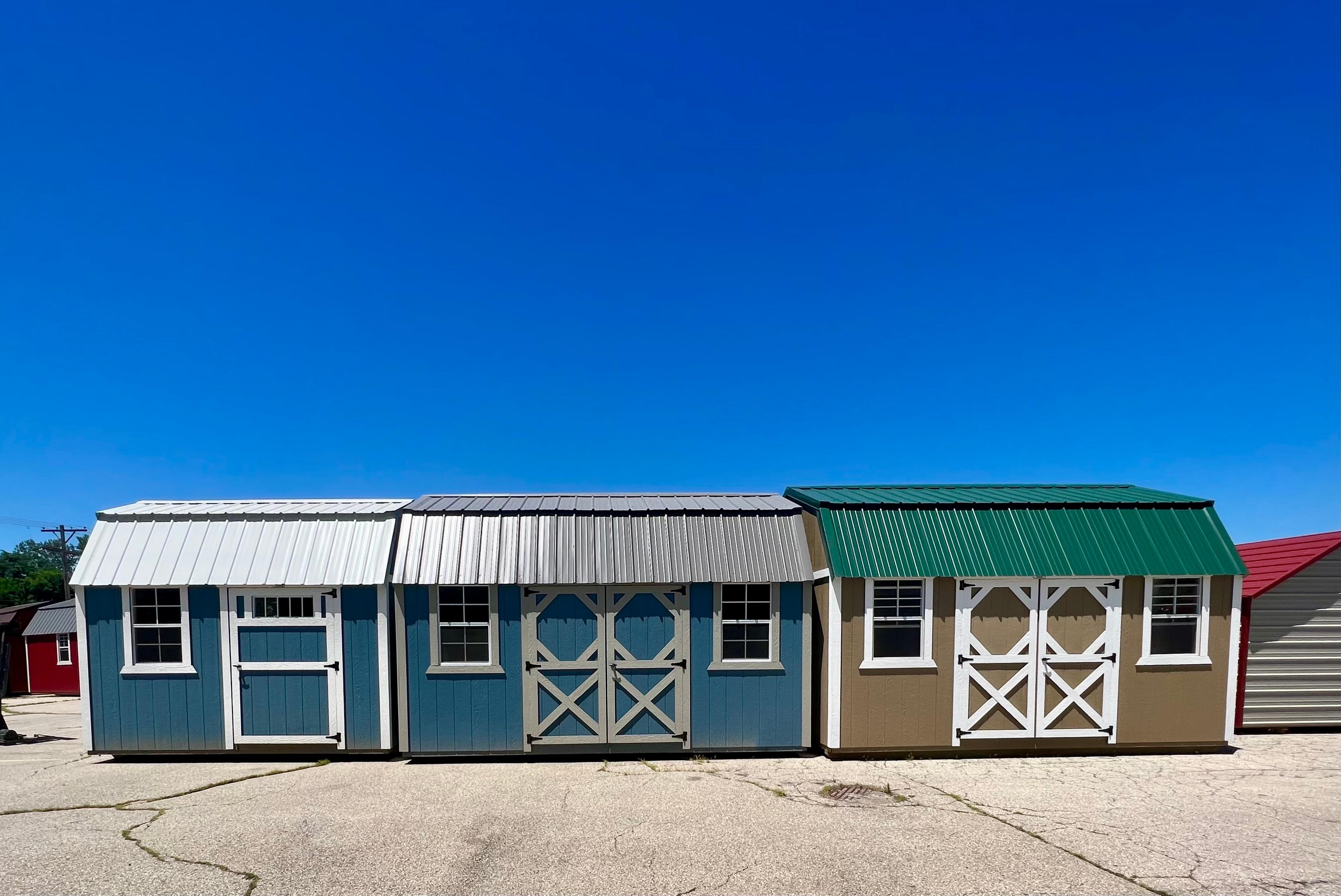 Small portable side lofted storage sheds.