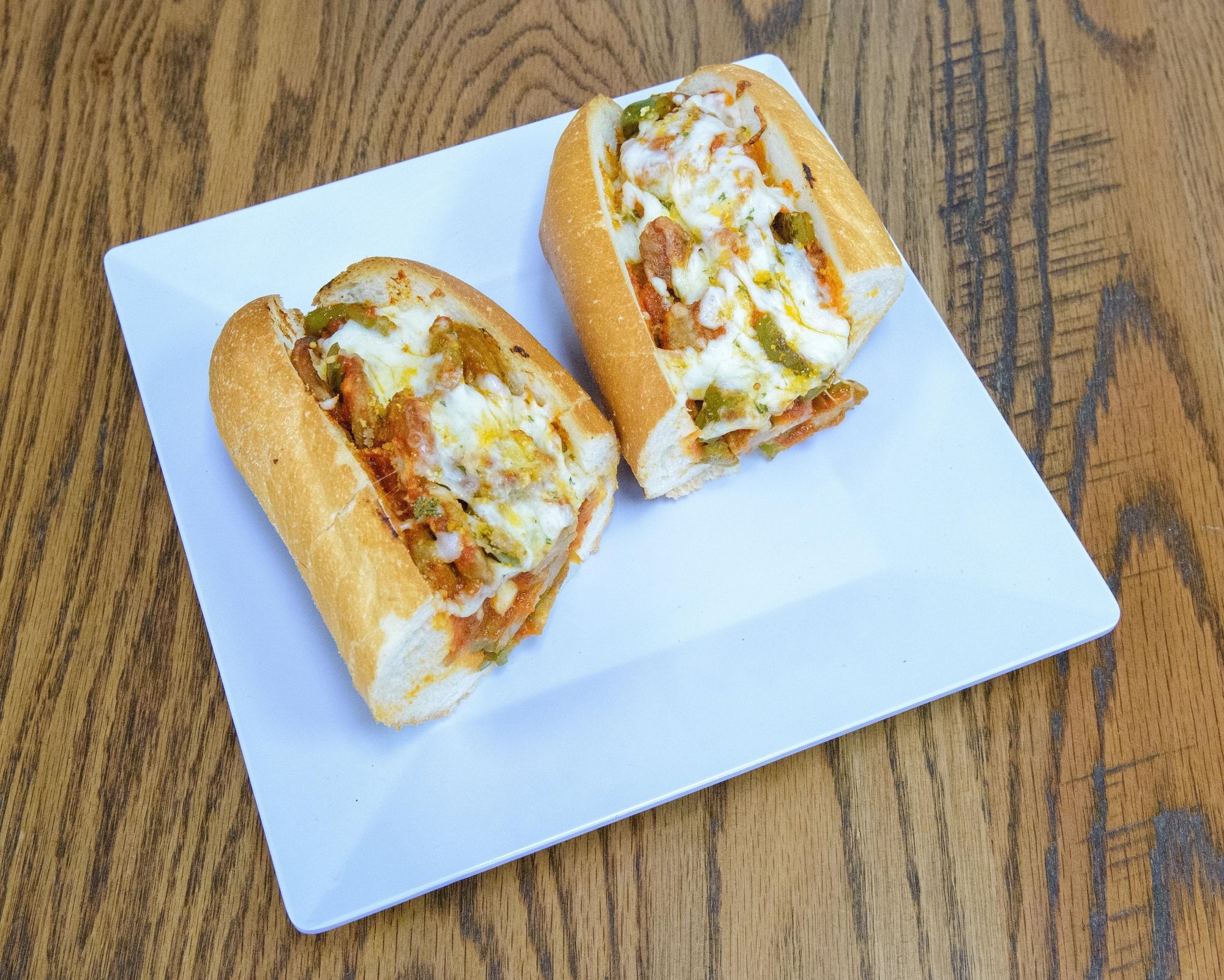 Sausage & Peppers Parm Hero