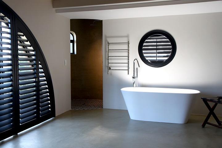Who doesn't love a luxurious bath? We love how these black PureVu Norman Shutters  highlight the pristine white bathroom giving it some oomph and much-needed privacy.  BudgetBlindsNassauBellmore   Shutters  NormanShutters  FreeConsultation  WindowWednesday