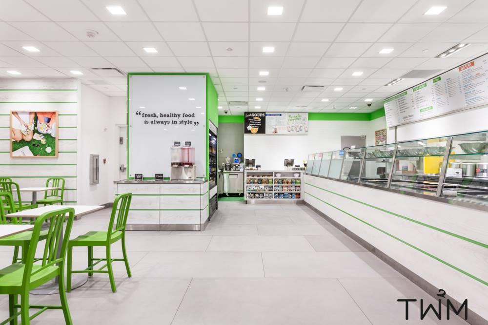 TW2M is excited to announce the completion of Just Salad at Macy's herald. White Wash wood, custom cut floor tiles. 