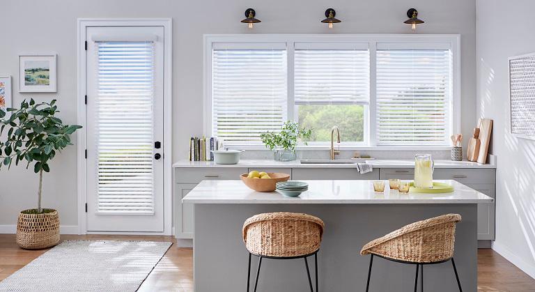 Our Faux Wood Blinds resemble the expensive look of real wood blinds but stand up against areas of high humidity and moisture, letting you choose the perfect window coverings for each room, especially bathrooms and kitchens.