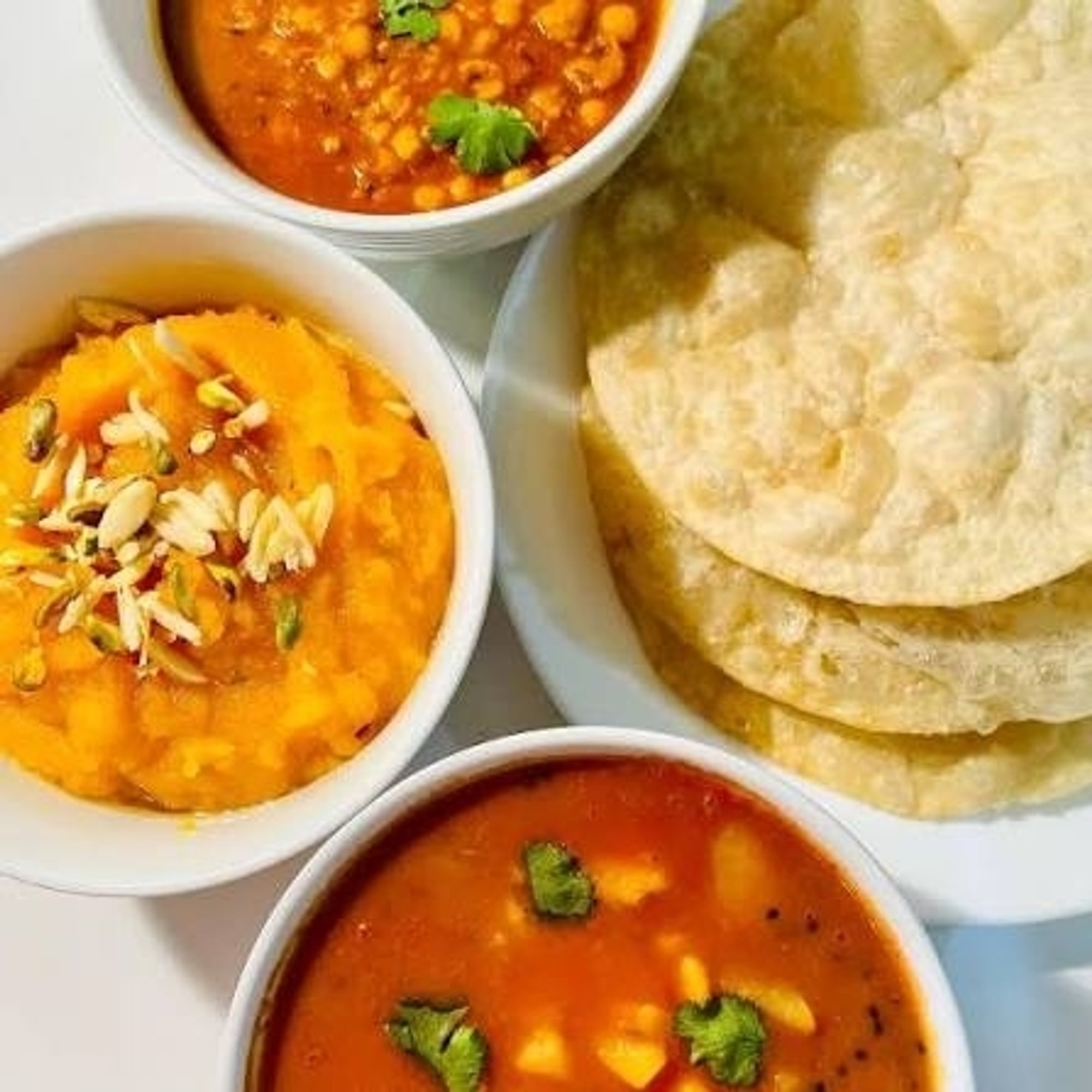 Halwa-Puri Paratha-Aloo Cholay Platter